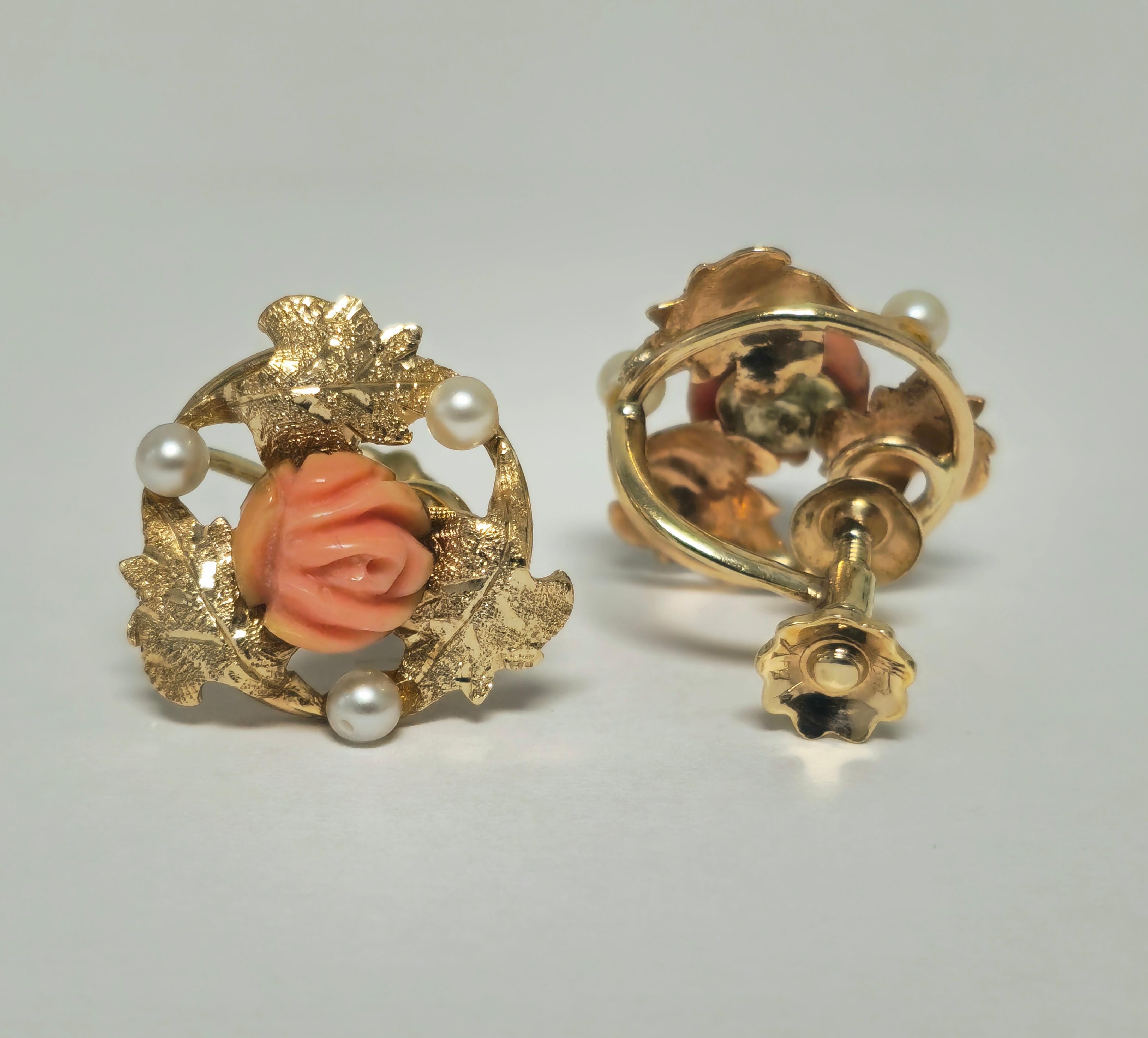 Fashioned from lustrous 14k yellow gold, these exquisite earrings boast a total of 3.20 carats of natural gemstones, including captivating coral and elegant pearls. The coral, fashioned into a delicate rose motif, exudes timeless charm, while the