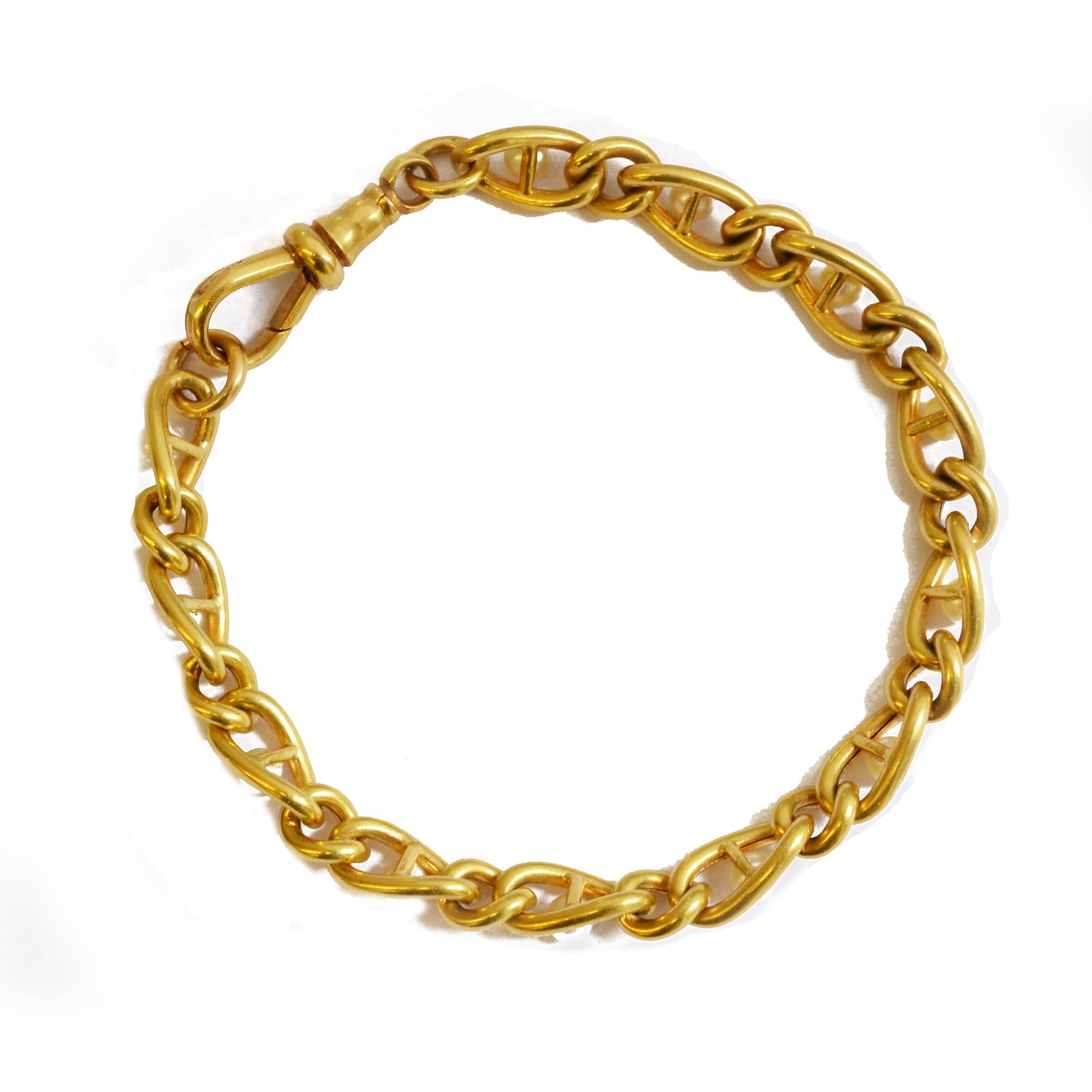 A Victorian 18ct yellow gold curb link bracelet, set with natural Oriental pearls. English, circa 1890.
