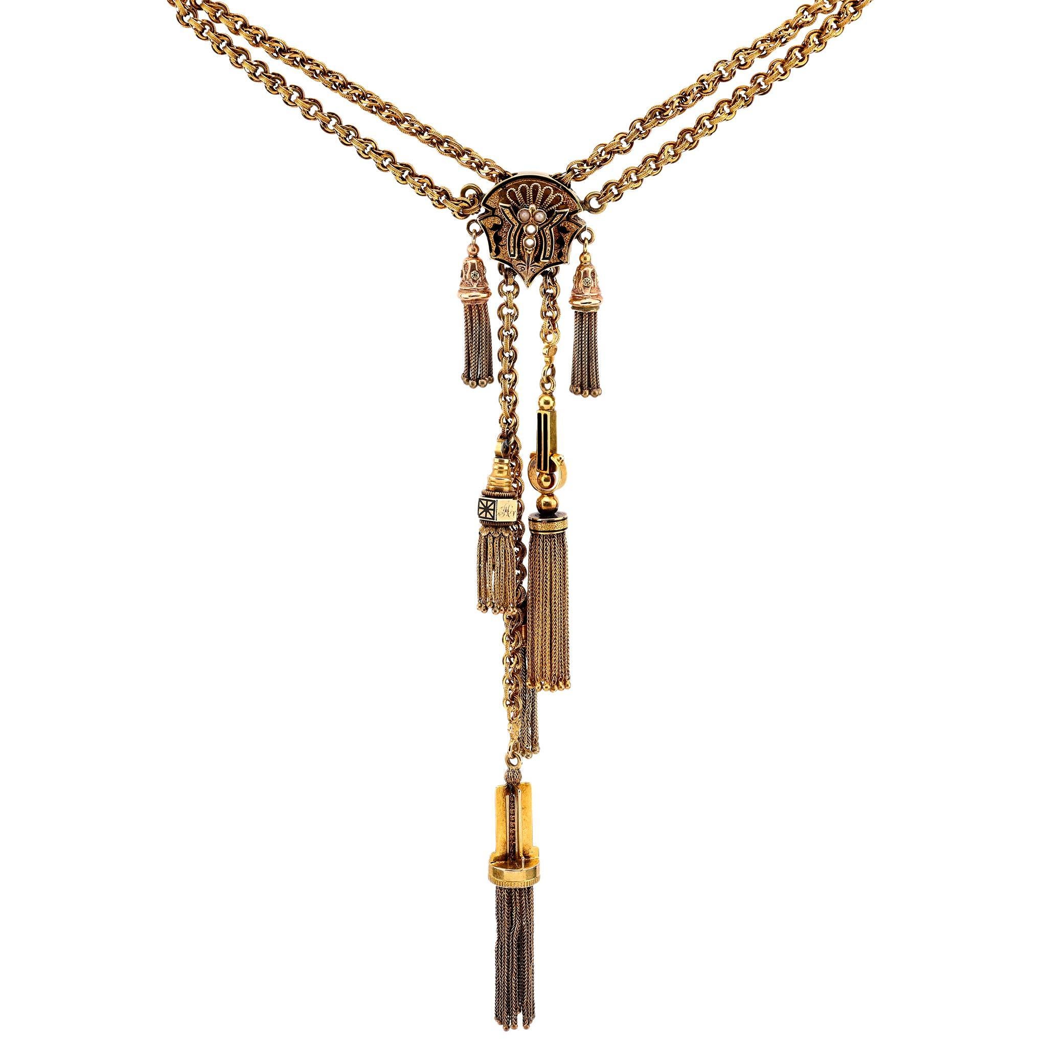 This Victorian tassel necklace in 14k yellow gold showcases lustrous natural pearls and intricate black enamel accents, offering timeless elegance and vintage charm.

Center stone: 4 natural pearls
Size: Approximately 2mm
Metal: 14k yellow gold and