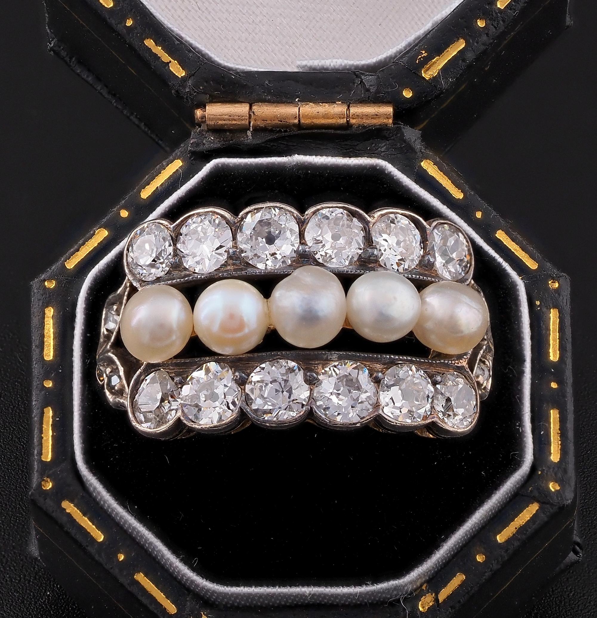 A distinctive Victorian Diamond Natural pearl ring, 1890/1900 ca
Hand crafted of solid 18 KT gold topped by Platinum
Understated design, comprising three rows of gemstones set between old mine cut Diamonds and Natural salt water, not