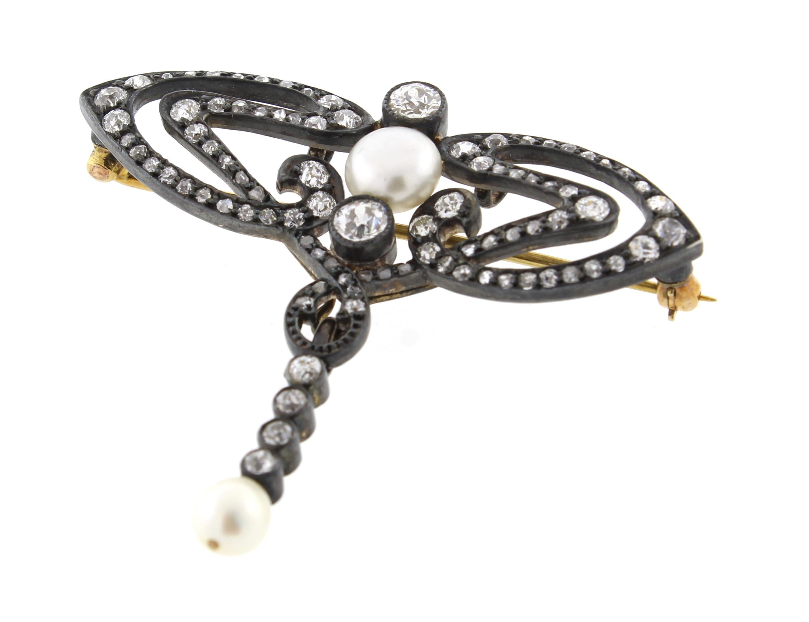 This Victorian diamond and natural pearl brooch features a detachable pearl drop. The  hand workmanship an impeccable example of Victorian design.
♦ Metal: Silver over gold
♦ 30 round diamonds=1.10
♦ 60  mixed cut diamonds=.75 carat
♦ Circa: mid to