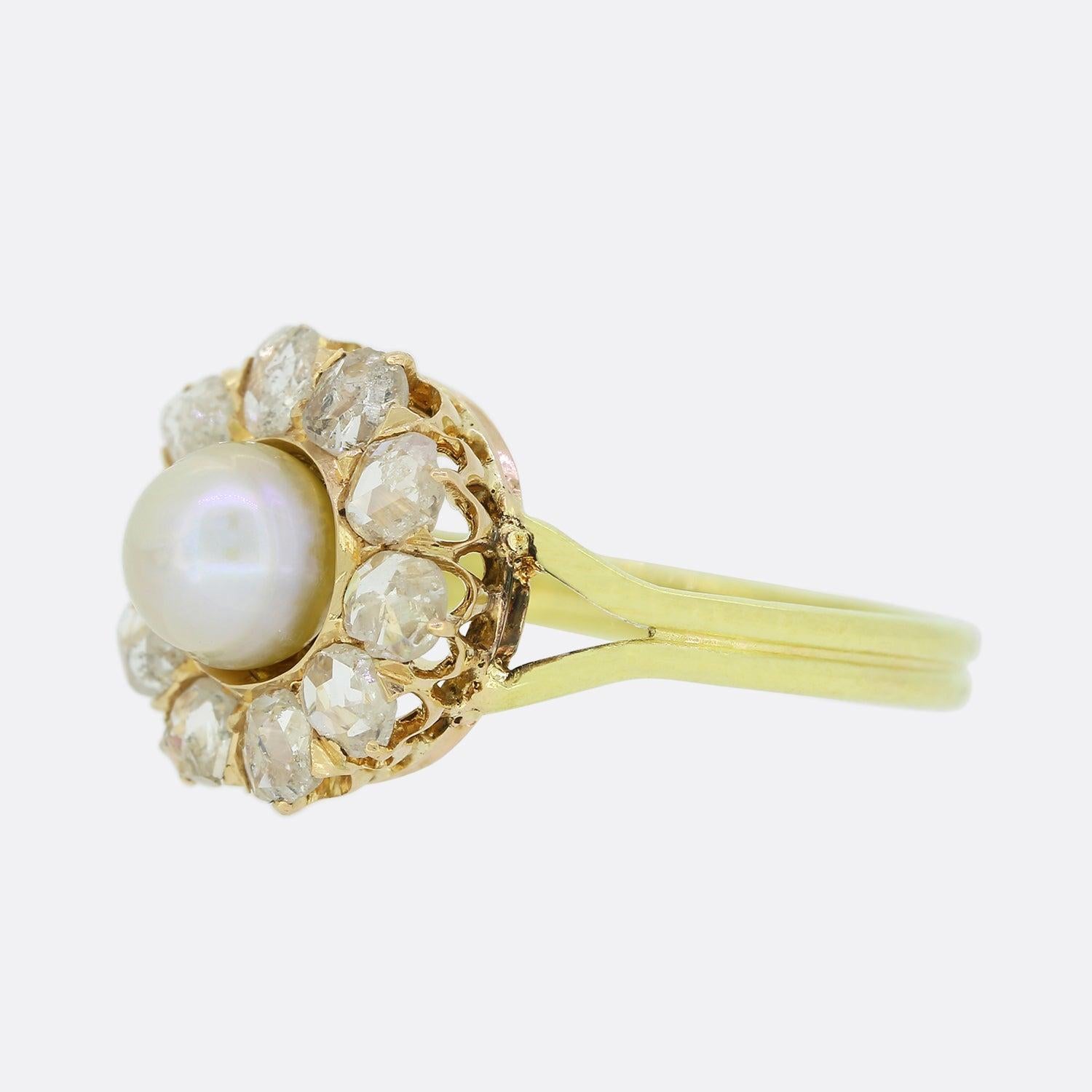 This is a superb 18ct gold pearl and diamond cluster ring. Set upon a rose gold head, the central natural pearl possesses a wonderful lustre whilst the encompassing stones which circulate the outer edge are bright white sparkling rose cuts diamonds.