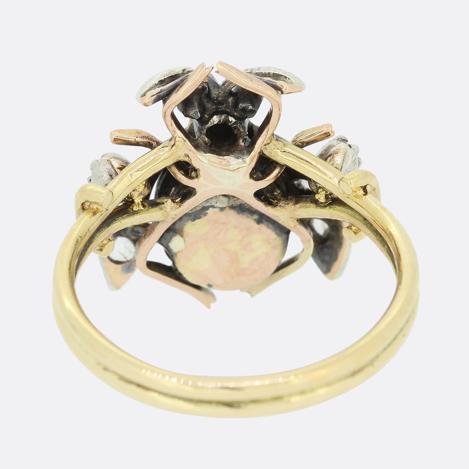 This is an 18ct yellow gold diamond, pearl and ruby fly ring. The ring consists of natural black pearl which makes up part of the body while the wings have been set with rose cut diamonds and the eyes set with rubies. The head of the ring originally