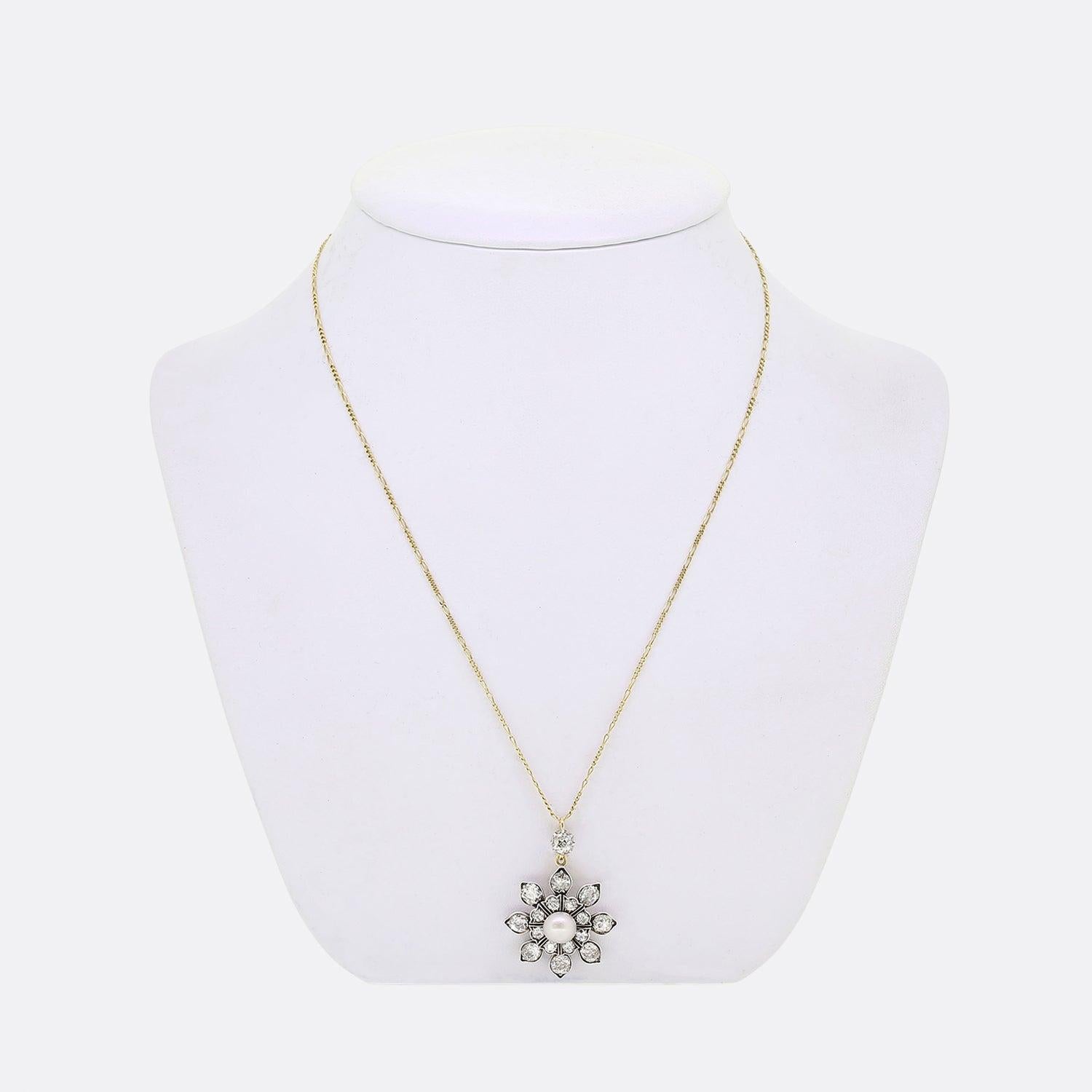 Here we have an exceptionally crafted necklace from the Victorian era. The frame of this multi-layered antique pendant has been formed into the shape of a sunflower with a semi-round natural pearl at the centre. This focal stone possesses a lovely