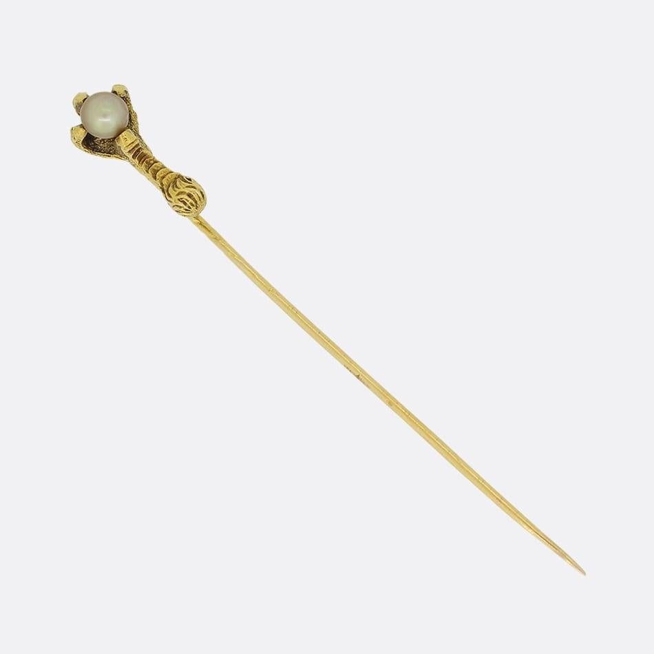 This is a rare and high quality 18ct yellow gold talon stick pin. The pin is from the Victorian era and features a single natural pearl.

Condition: Used (Good)
Weight: 2.9 grams
Head Dimensions: 17.5mm x 7.7mm
Natural Pearl: 4.9mm
Tested As: 18ct