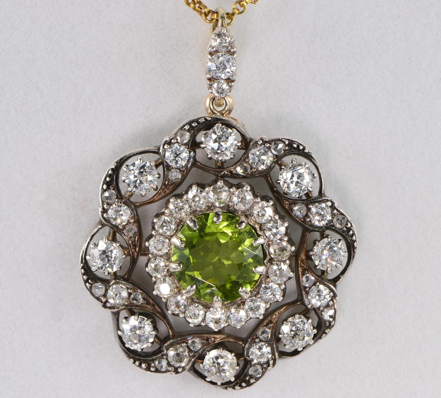 This marvellous Victorian brooch pendant is 1880 ca
Hand crafted of solid 18 Kt gold with silver portions in a round shape
Principle stone is a bright and sparkly round faceted cut natural Peridot of vivacious lime green colour, 2.60 Ct – 9.09 mm.