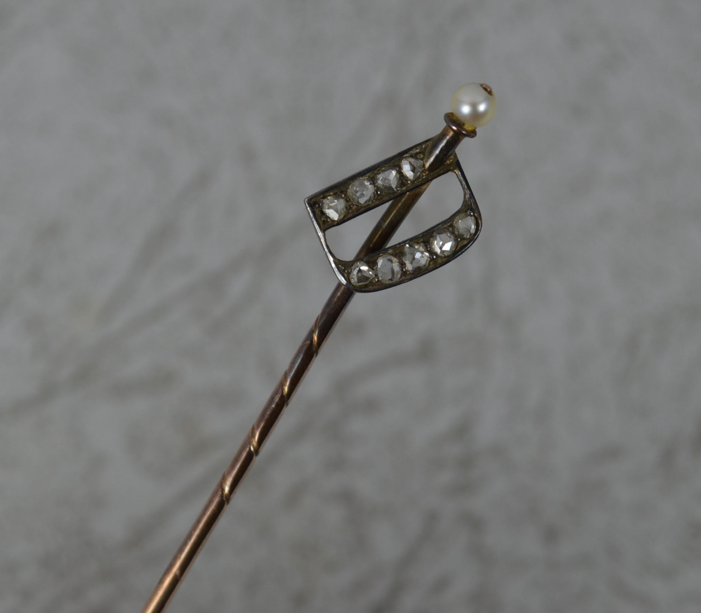 A beautiful antique stick or tie pin with D initial to the top. 
Solid 9 carat rose gold example.
Designed with a pearl to the top and the D initial set with natural rose cut diamonds.
​64mm long. 8mm x 10mm D. 1.4 grams.

Condition ; Very good.