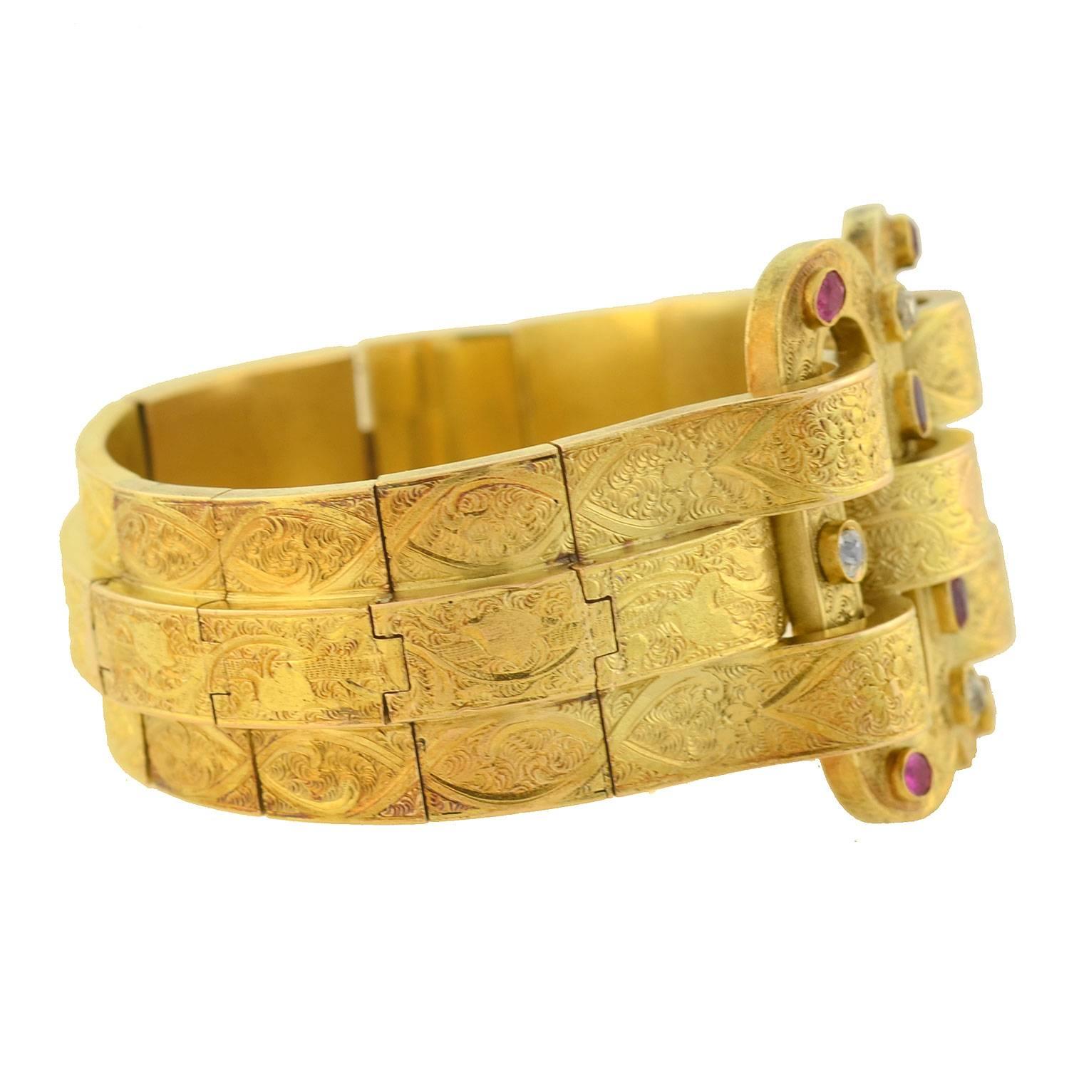 An absolutely outstanding gold bracelet from the Victorian (ca1880) era! This incredible 3-dimensional piece is crafted in vibrant 15kt yellow gold, and is quite substantial in both size and appearance. A large double buckle-like design rests at the