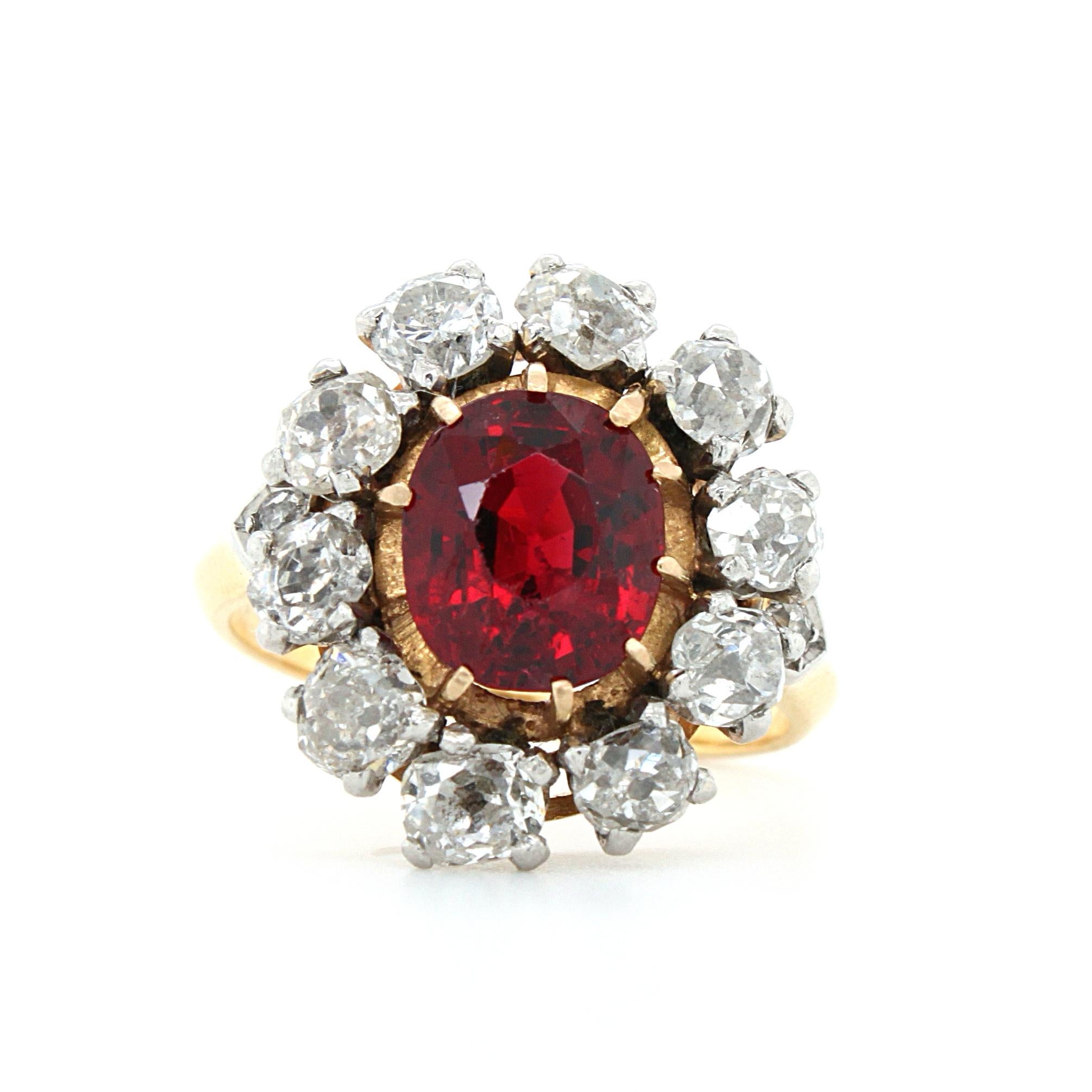 A fine antique red spinel and diamond ring in 18k yellow gold, early Victorian, ca. 1860s. The centre gemstone is an antique cushion cut spinel - not heated - accompanied by a gemological report. The spinel weighs 2.41 carats and has a vivid red