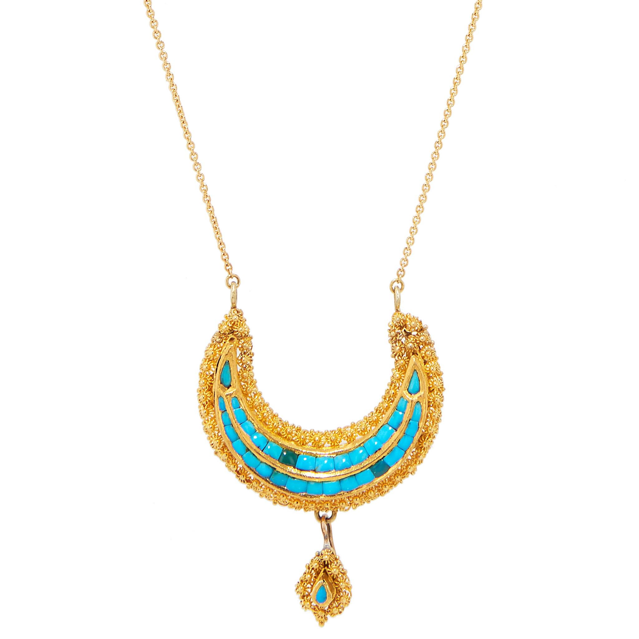This gorgeous Victorian pendant is handcrafted in 15 karat yellow gold with natural turquoise. 

The pendant hangs from a new 18 karat yellow chain. The necklace and pendant measure 19 inches long. Each chain, on the right and left measure 8 inches