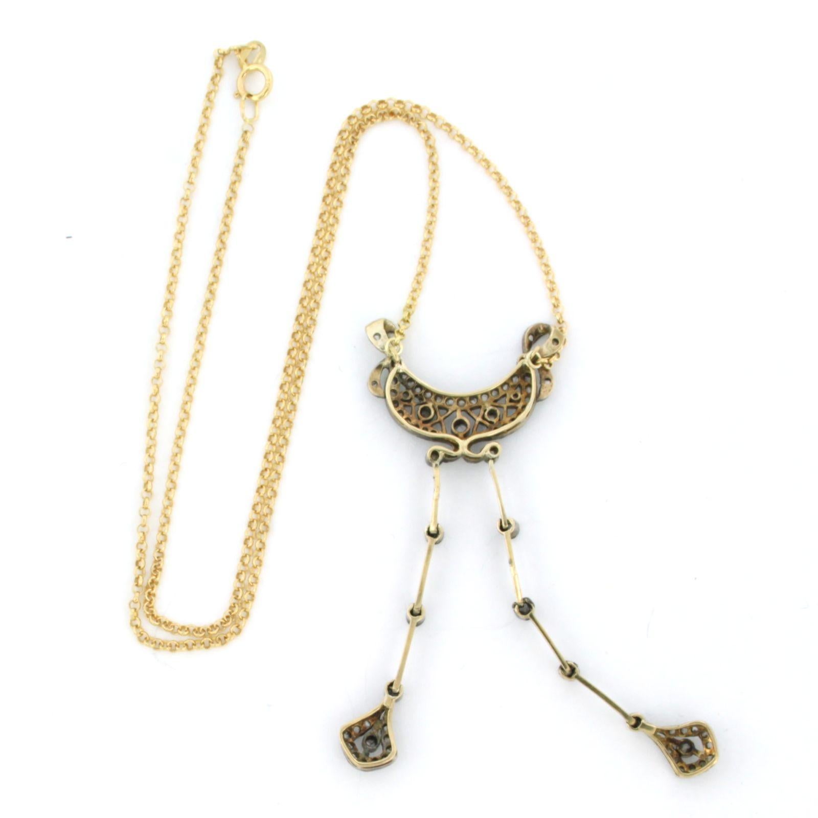 18k yellow gold necklace with a gold and silver centerpiece set with rose diamonds up to 0.30 ct – G/H – SI – 45 cm long

Detailed description:

The necklace is 45 cm long and 0.7 mm wide.

The centerpiece is 2.5 cm wide and 6.8 cm long.

Weight: