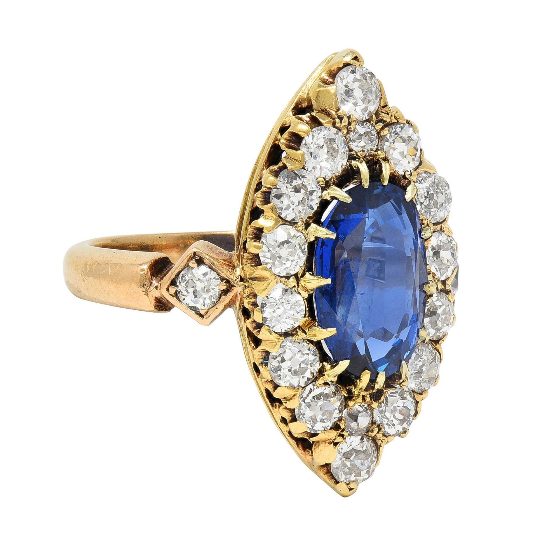 Centering an elongated cushion cut sapphire weighing 2.61 carats - transparent medium blue in color
Natural Burmese in origin with no indications of heat treatment - set with talon prongs in navette form
Featuring a navette-shaped surround prong set