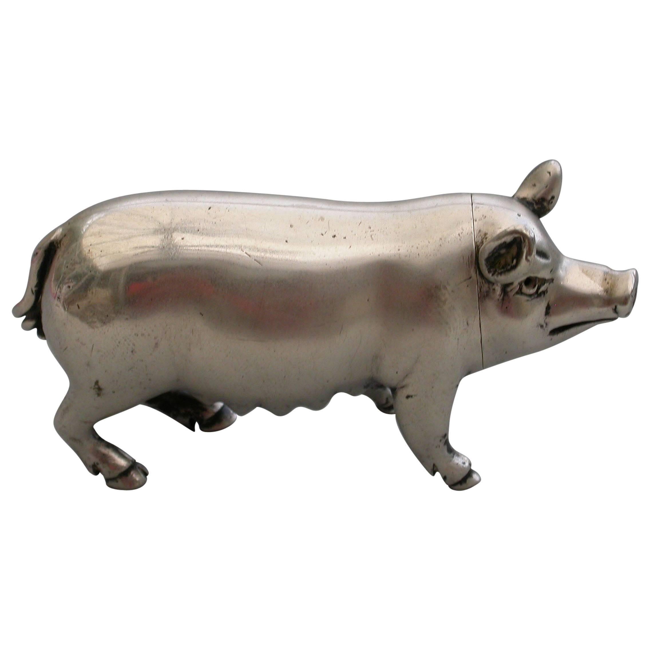 A fine quality Victorian novelty cast silver Pepper made in the form of a Pig, with pull- off pierced head and silver gilt interior. 

By Jane Brownett, London, 1890.

In good condition with no damage or repair

Measures: Height 39 mm (1.54