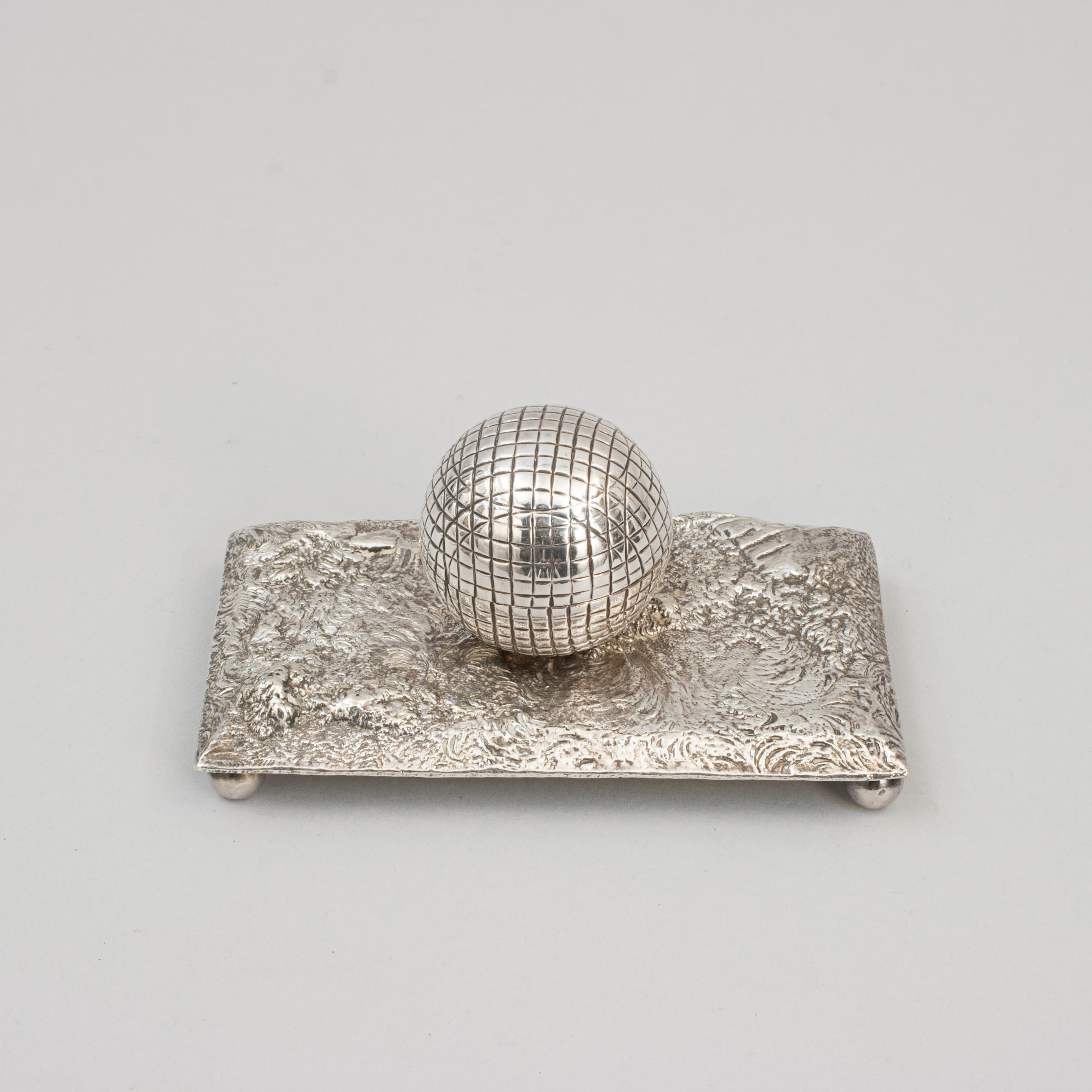 Victorian Novelty Golf Silver Plated Inkwell. 
A fine quality plated golf inkwell with rectangular base raised on four ball feet. There is a single ink well mounted onto the base in the shape of gutter percha golf ball. The hinged lid on the golf