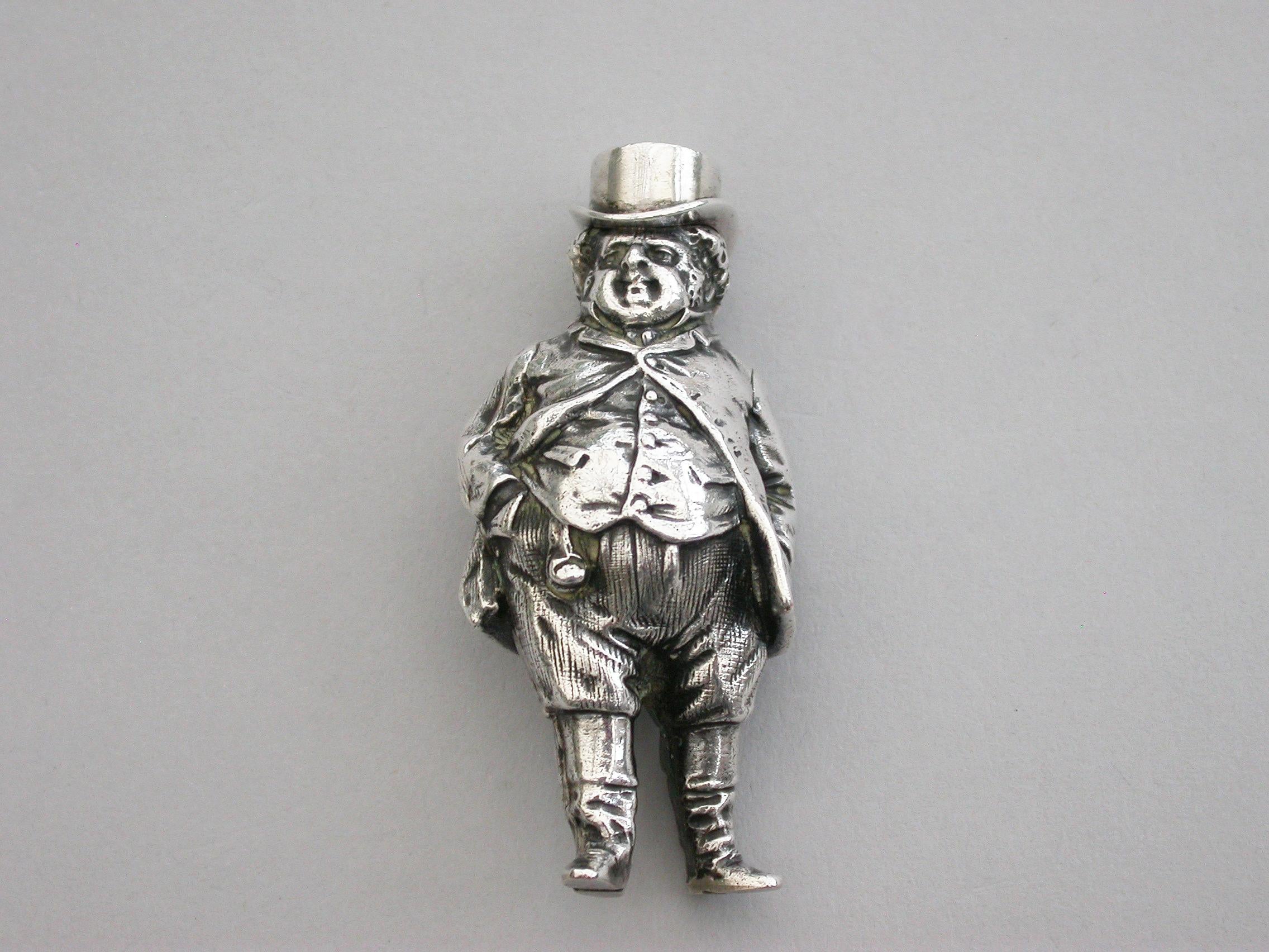 An extremely rare Victorian figural novelty silver telescopic propelling pencil made in the form of the comical literary character John Bull (the personification of an Englishman), depicting the stout man wearing a tailcoat, breeches and boots.