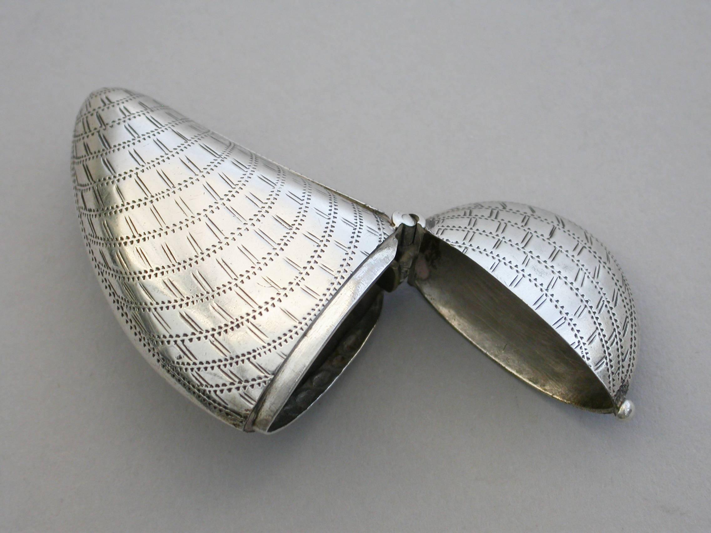 A rare Victorian novelty silver vesta case made in the form of a Mussel Shell, with hinged flip-top lid and prick-dot and scratch engraved decoration to simulate a real shell.

By Hillard & Thomason, Birmingham, 1881

In good condition with no