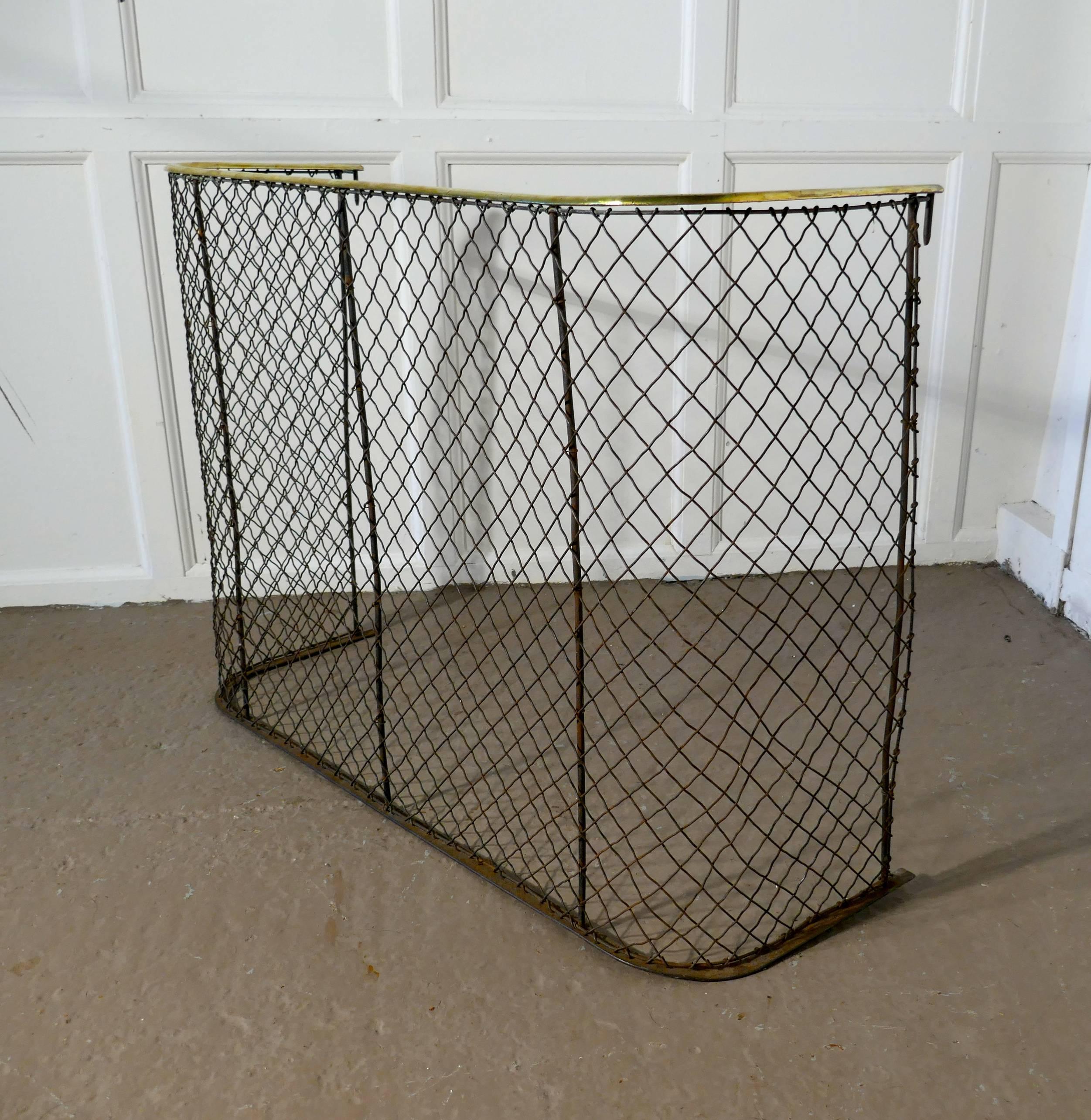 A Victorian nursery fire guard, brass fender

A high Victorian antique fire guard often known as a nursery guard as it completely surrounds the fire 
The slightly curved brass topped rail is in very good order as is the wire chain mesh 
Measure: