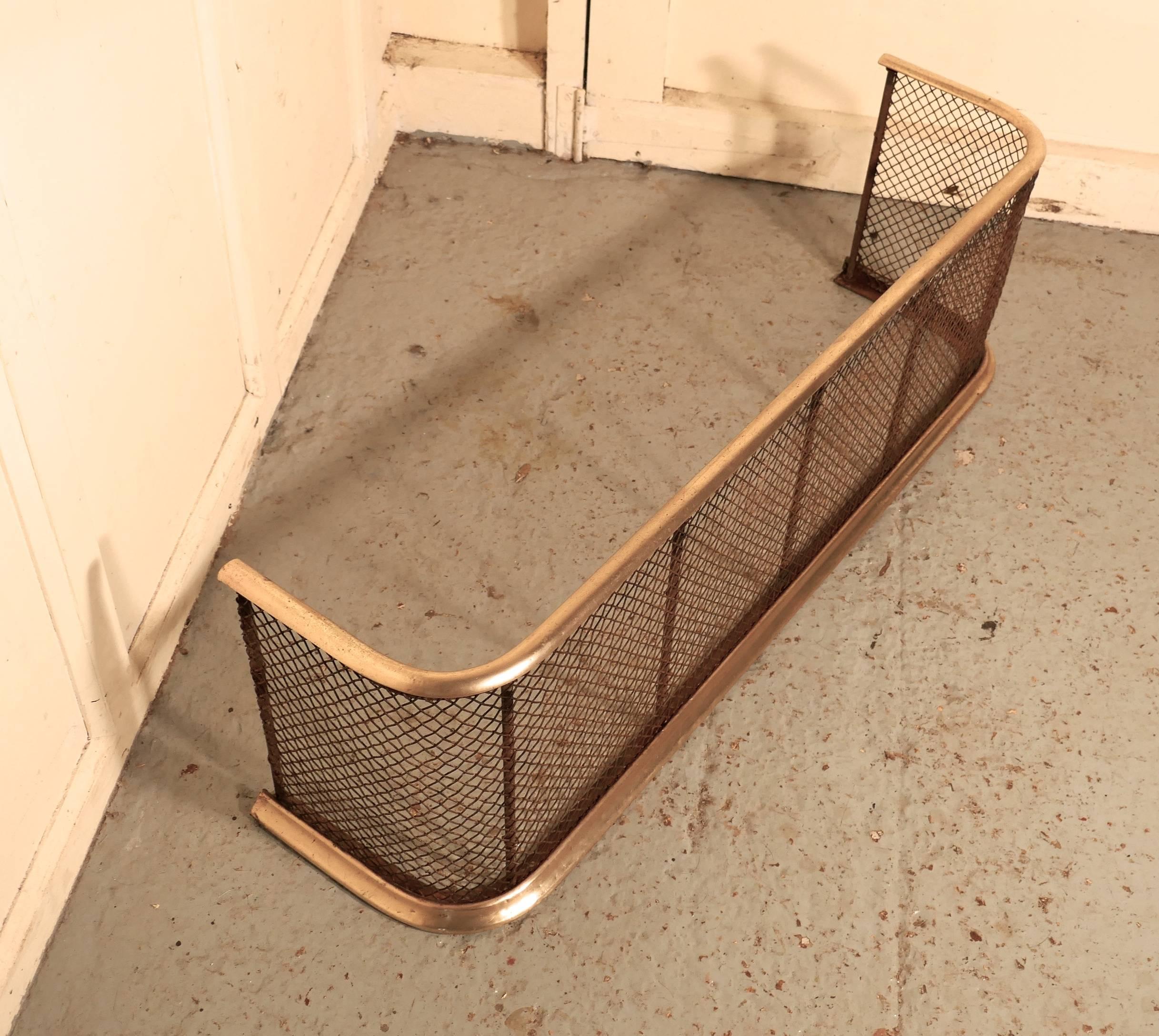 Victorian nursery fire guard or fender.

This is a Victorian antique fender often known as a nursery guard as it completely surrounds the fire
The fire guard has a slightly curved brass top rail and a brass bottom rail, the fender is in all round