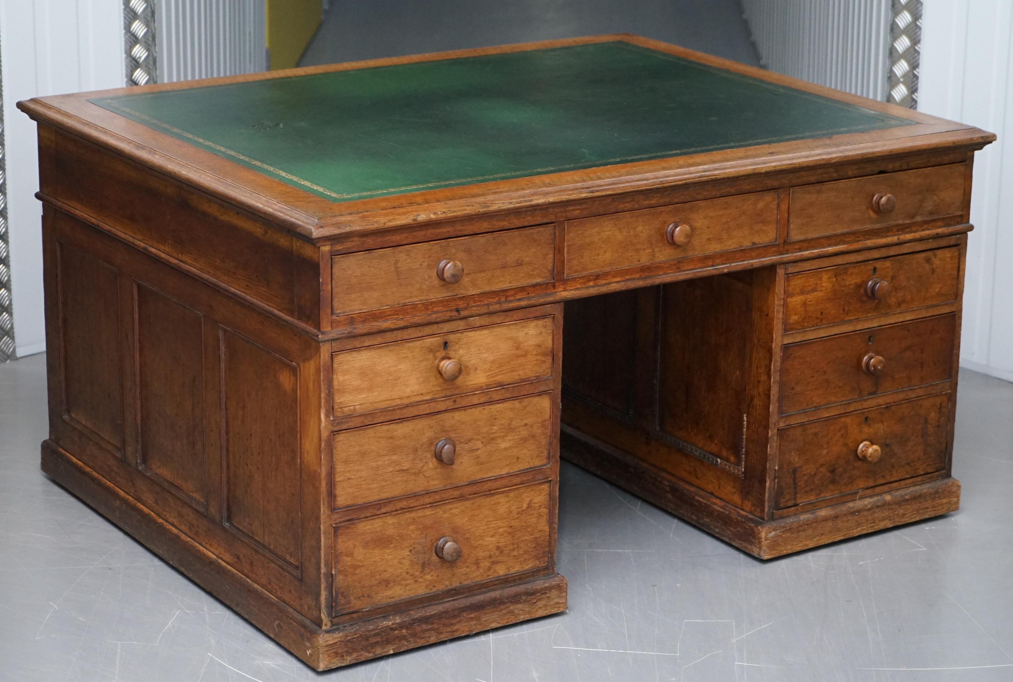 We are delighted to offer for sale this large Victorian twin pedestal 18 drawers double sided solid oak partner desk with green leather top and oversized casters 

This desk is a good large size, originally designed as you can see for two people