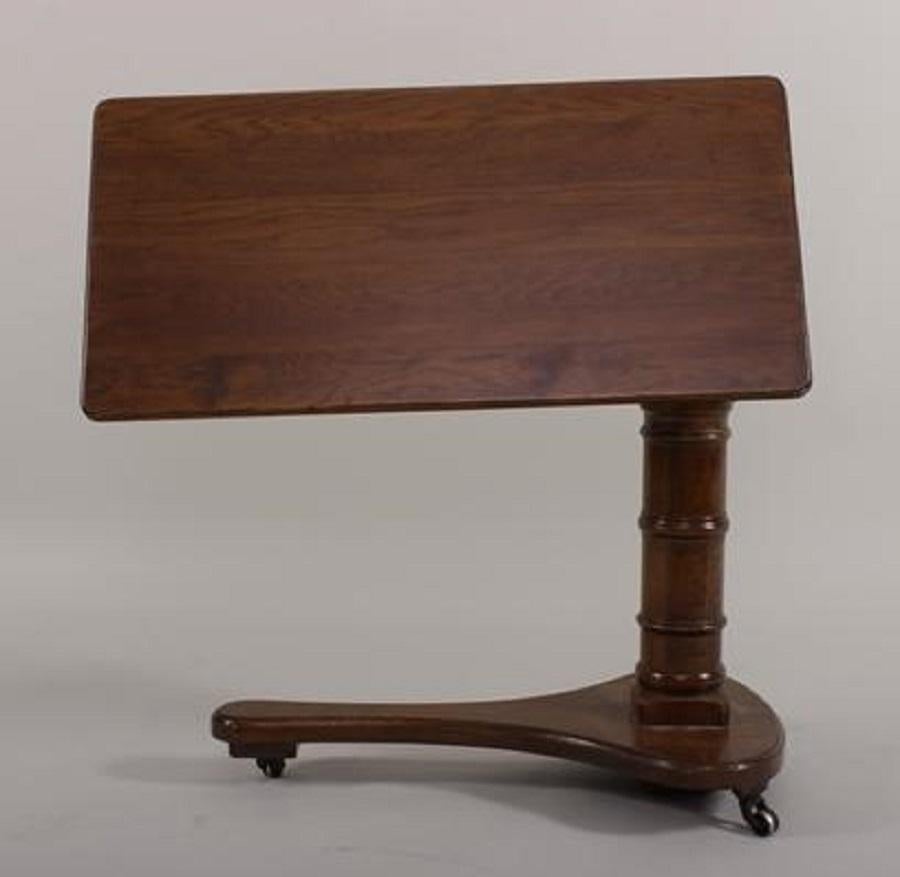 Victorian oak bed table with tilt top, Mid-Late 19th C. Dimensions: 33 H x 32 W x 15 1/2 D.
 