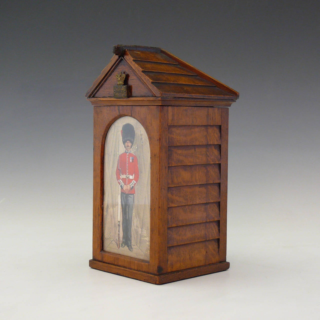 An oak cigar box modelled as a sentry box with a watercolor of uniformed guardsman in his bearskin, by renowned military artist Richard Simkin, circa 1890.

During his lifetime, Richard Simkin produced thousands of watercolors depicting the uniforms