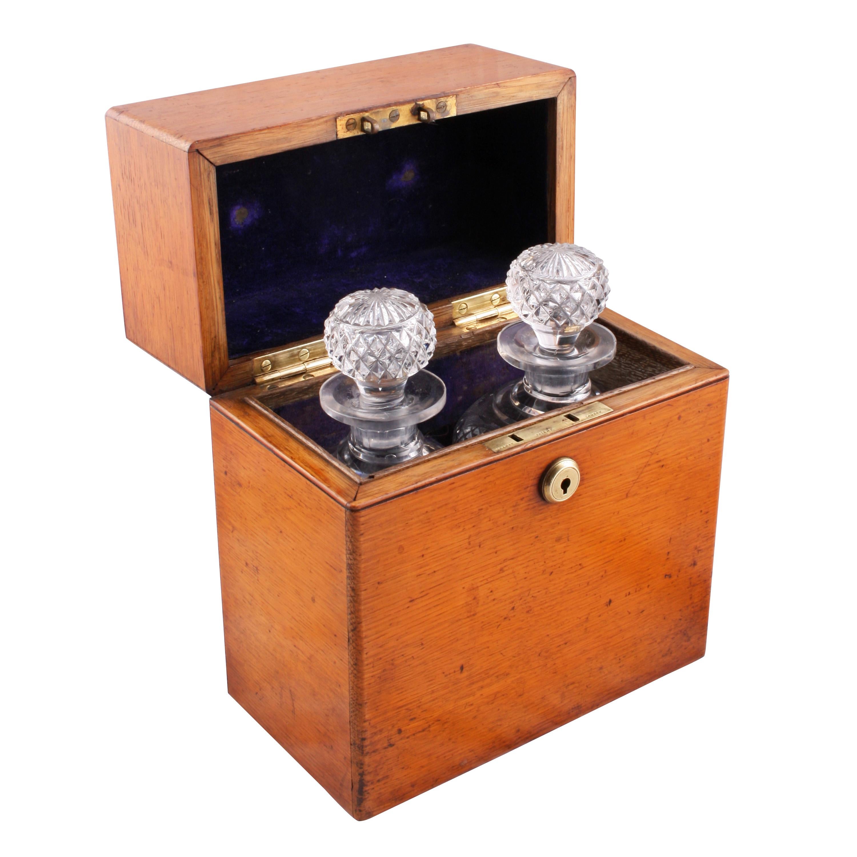 Victorian oak decanter box


A 19th century Victorian oak decanter box.

The box has a hinged lid, is velvet lined inside and holds two original matching spirit decanters.

The decanters are square based with chamfered corners and the upper