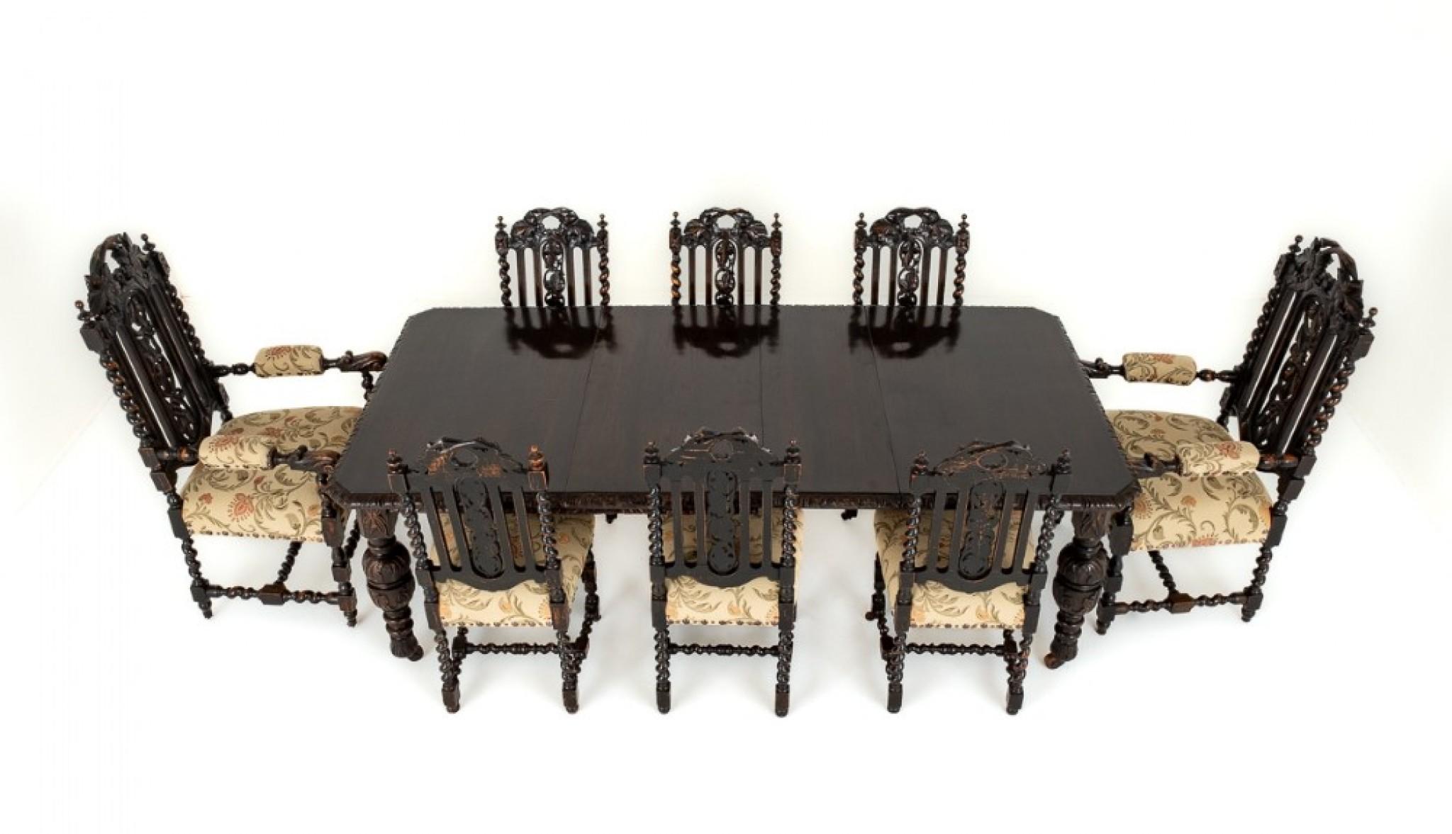 Victorian Carved oak Dining Suite.
Circa 1880
This Suite Comprises of 6 + 2 Carved Oak Chairs and a Extending Dining Table.
The Table Stands Upon Ring Turned and Carved Tudor Style Legs with Original Castors.
The Table Extend by way of a Pullout