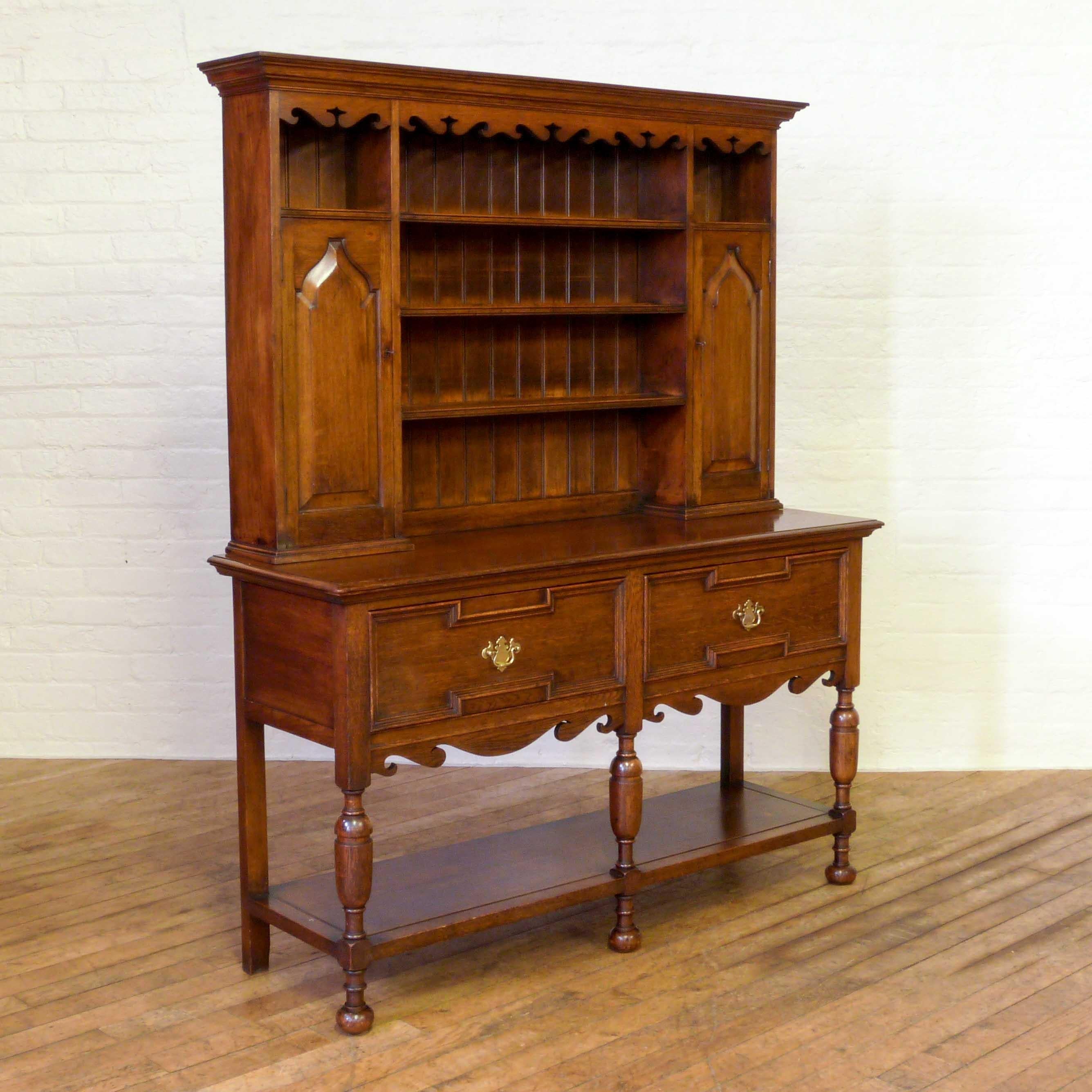 Late Victorian solid oak dresser of attractive proportions with good detail in the fretted cornice and apron, moulded drawers and baluster legs. Condition is very good.
 