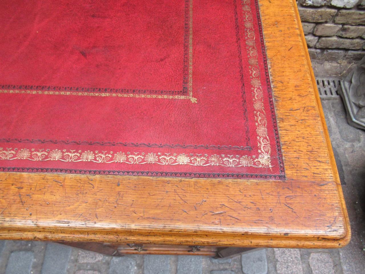 This magnificent desk is a fine early Victorian oak desk inspired by A.W.N Pugin and made by one of the nineteenth century's leading cabinet makers, Holland and Sons, this desk is of highly figured burr golden oak, with an excellent quality