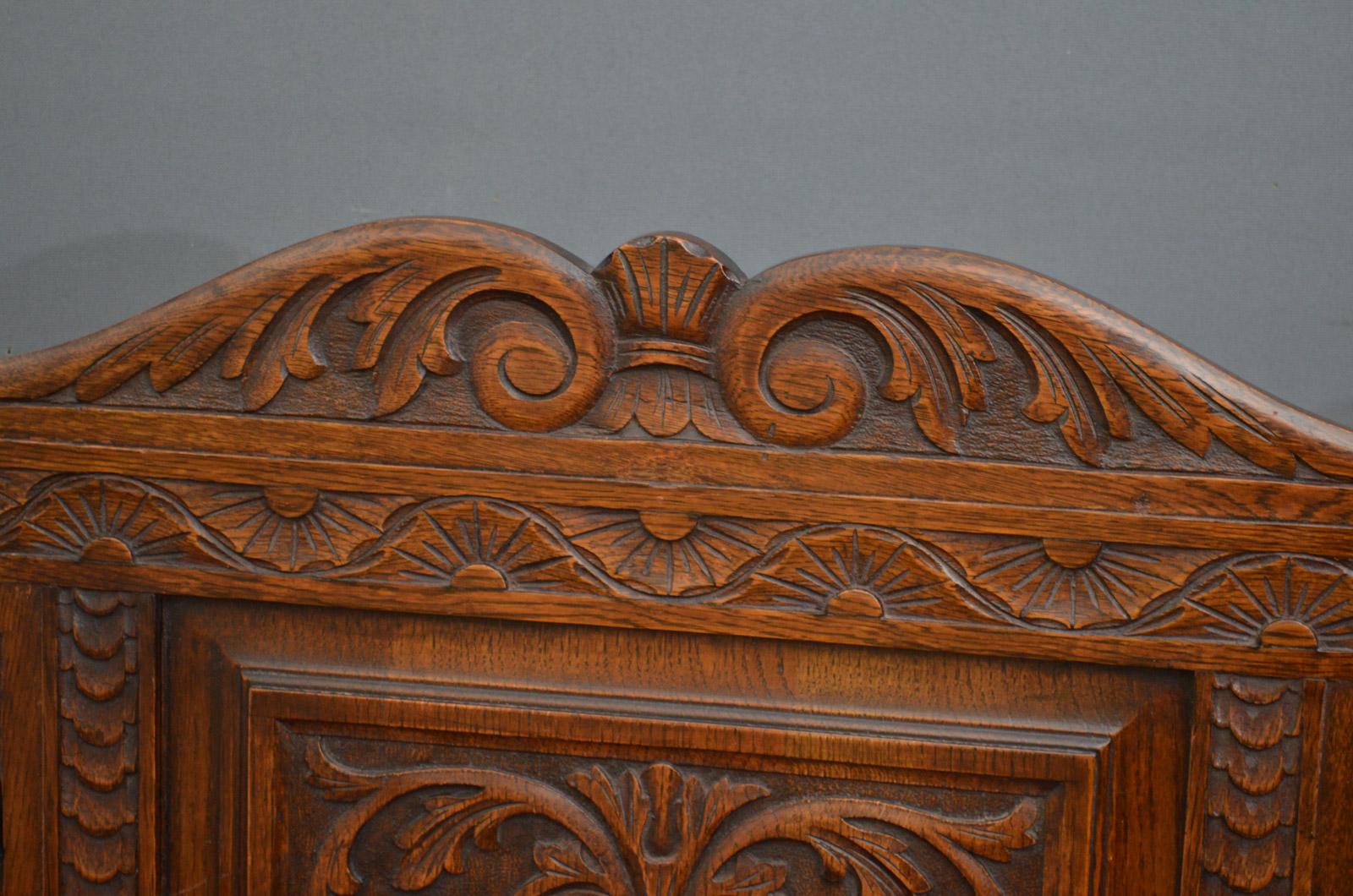 Sn3911, a Victorian oak box seat - box settle, having swan neck, finely card upstand to back, floral carved back with panelled centre flanked by eagles, above hinged seat flanked by reeded arms on turned supports, carved and panelled front, all