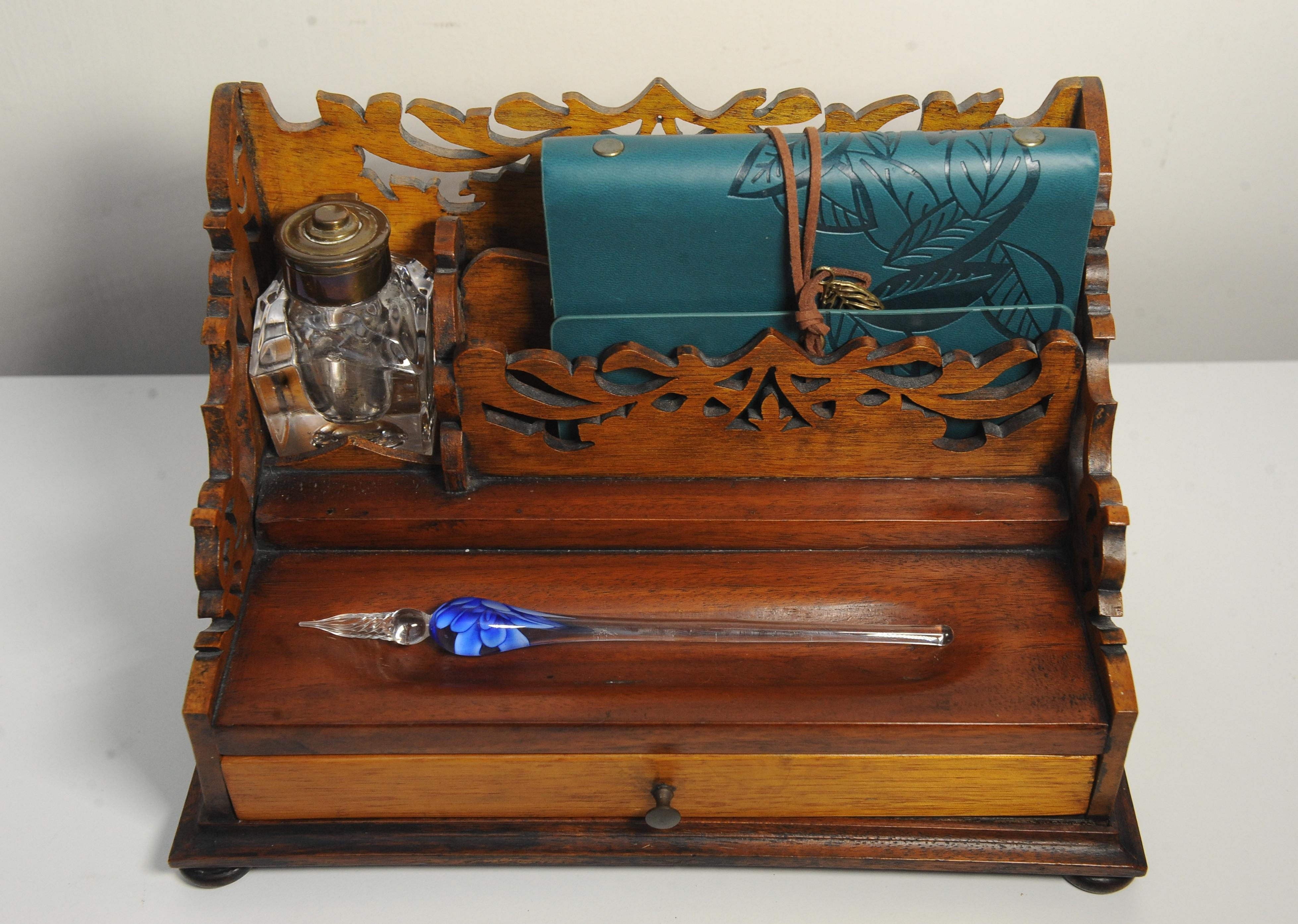 Elegant Victorian Oak Hand Crafted Desk Top Letter Rack With Intricately Cut, Art Nouveau Motifs Circa 1800's.

Supplied With a Heavy Cut Glass Brass Topped Inkwell, A Vintage Dip Pen & Modern Notepad

Ideal stationary/ envelope holder

