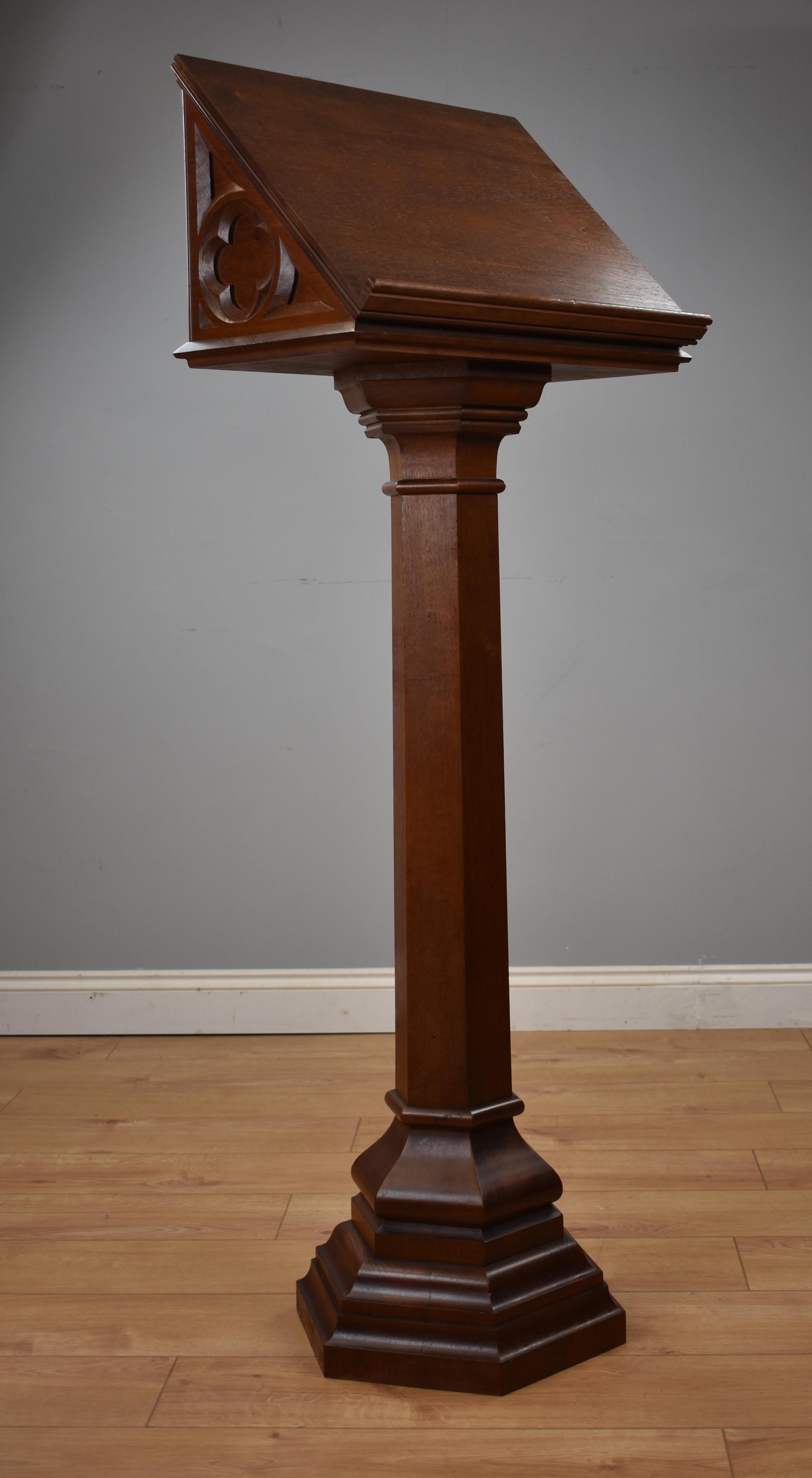 Victorian oak lectern in a gothic manner, the front carved with the initials 