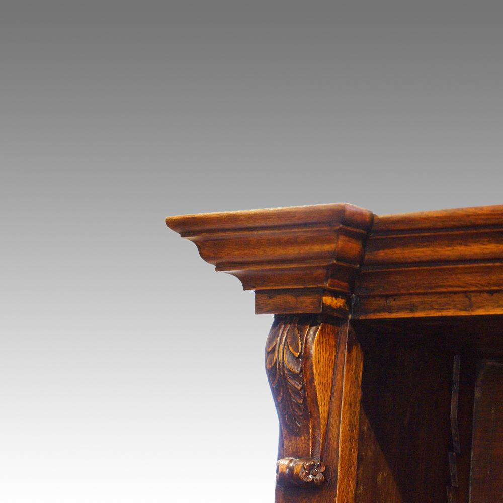 Victorian oak library bookcase 

Here we offer you this Victorian oak library bookcase with carved panel doors that are t dated 1641, although this bookcase was made circa 1880.
Commonly in the Victorian period, cabinetmakers would find panels of