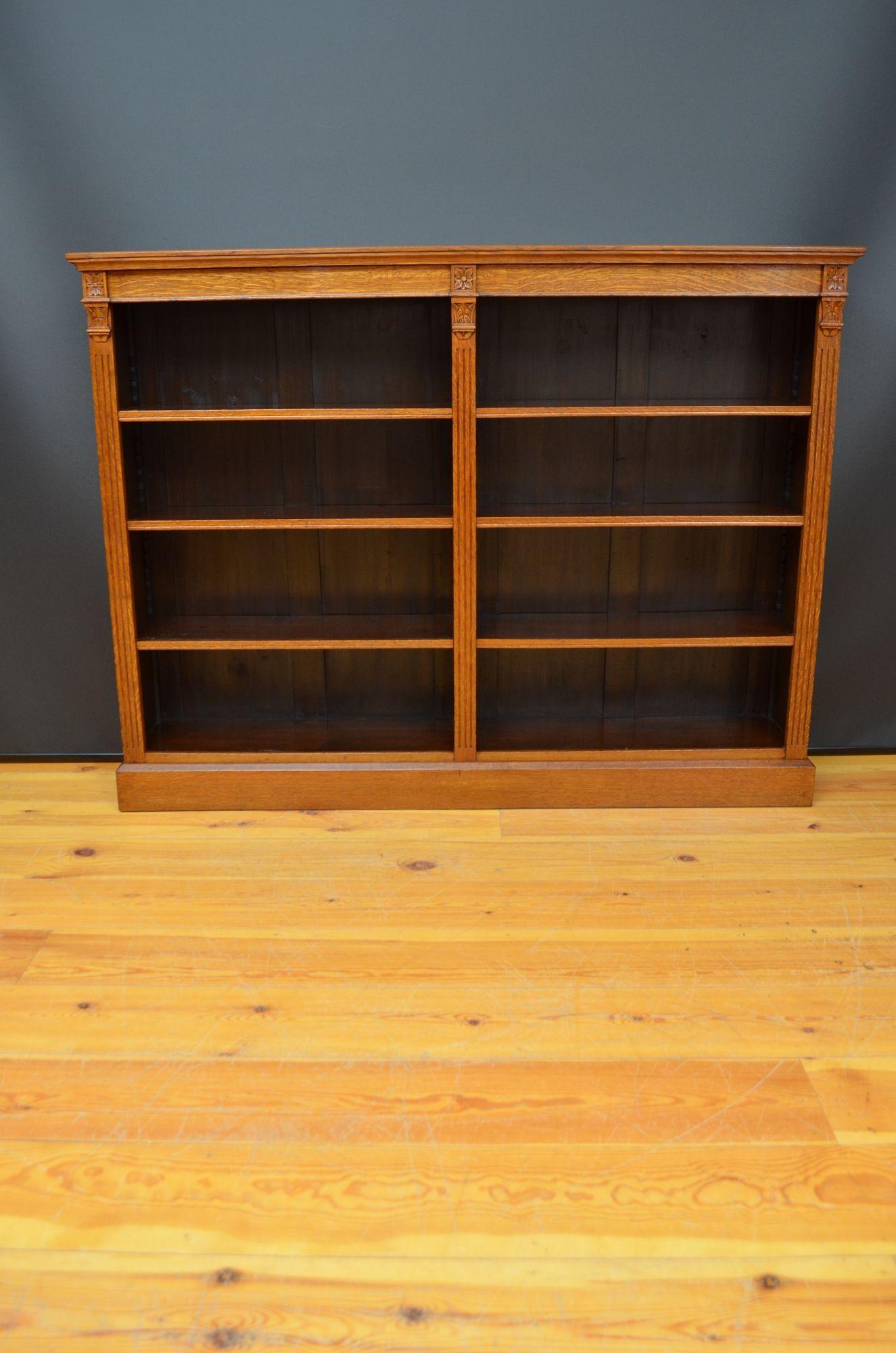 R045 Victorian oak open bookcase of good proportion, with a lovely warm colour. Solid oak top with good figuring to the grain.
The bookcase is divided into 2 halves with a central pilaster flanked with matching fluted pilasters either side, all