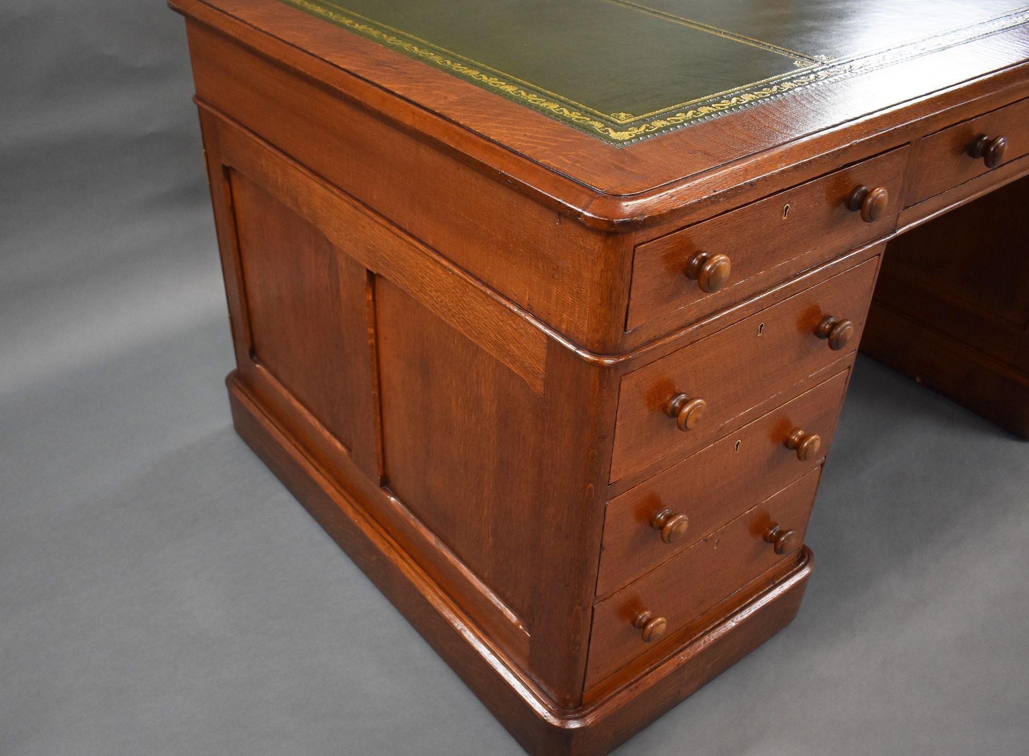 For sale is a good quality Victorian oak partners desk, having a quality green leather skiver writing surface, decorated with gold tooling, above three drawers to the front, and three drawers on the opposing side. Each pedestal has a further three