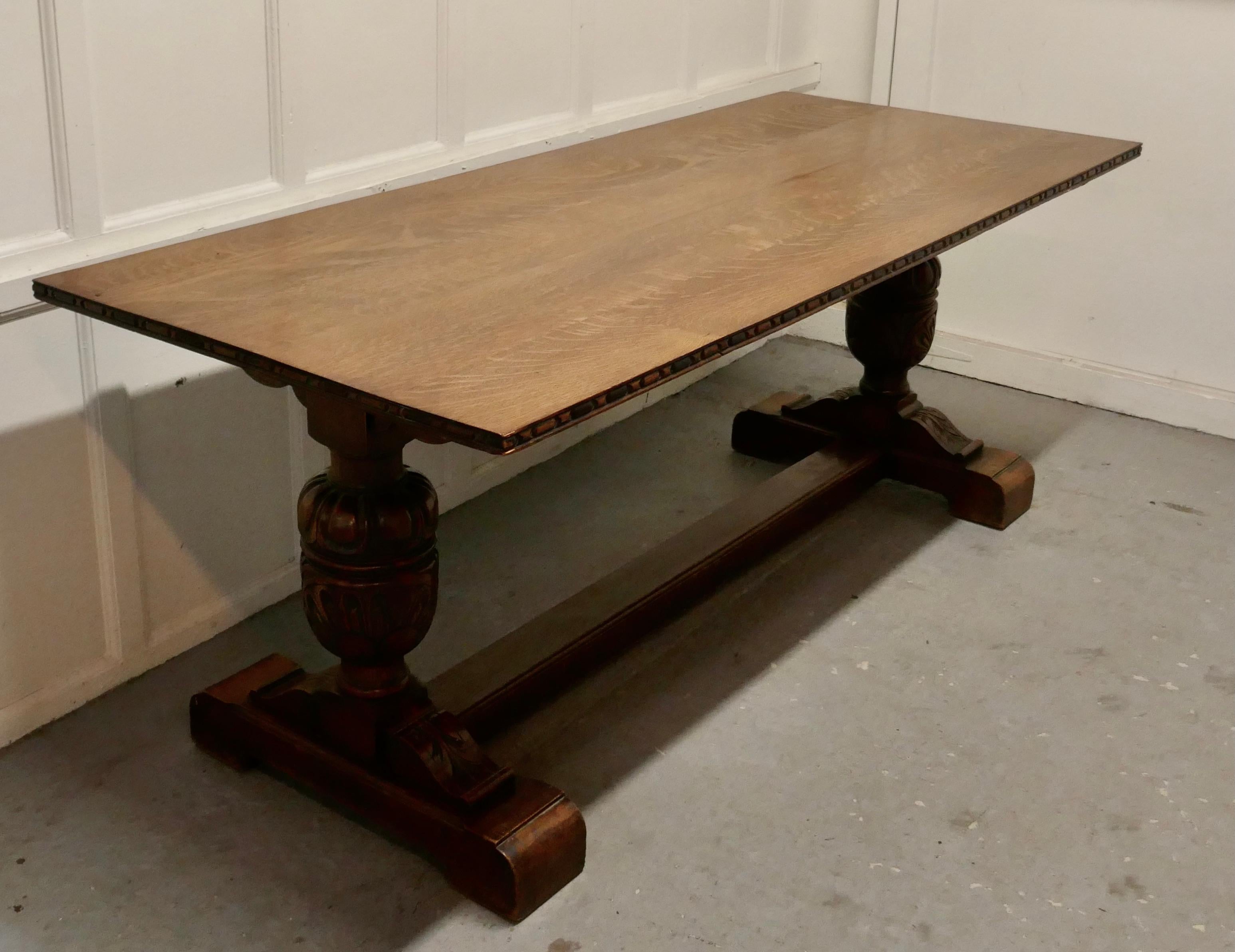 Victorian oak refectory table.

This is a good sturdy table, it has a solid oak planked top with a moulded edge, it has a good natural patina, the legs are in the refectory style with a floor Stretcher and bulbous pineapple carved legs these are