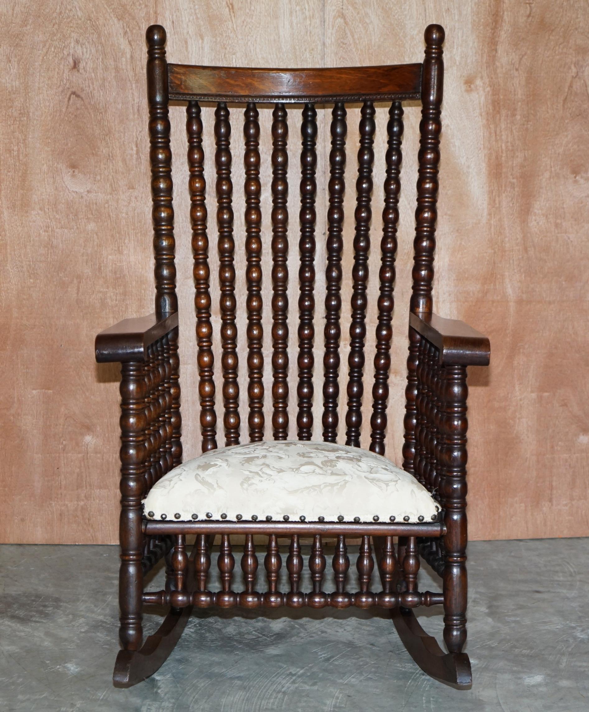 19th Century Victorian Oak Rocking Chair with Scottish Bobbin Turnings All over Cherub Fabric For Sale