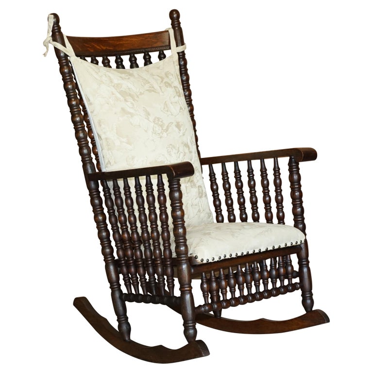 Victorian Oak Rocking Chair with Scottish Bobbin Turnings All over Cherub Fabric For Sale