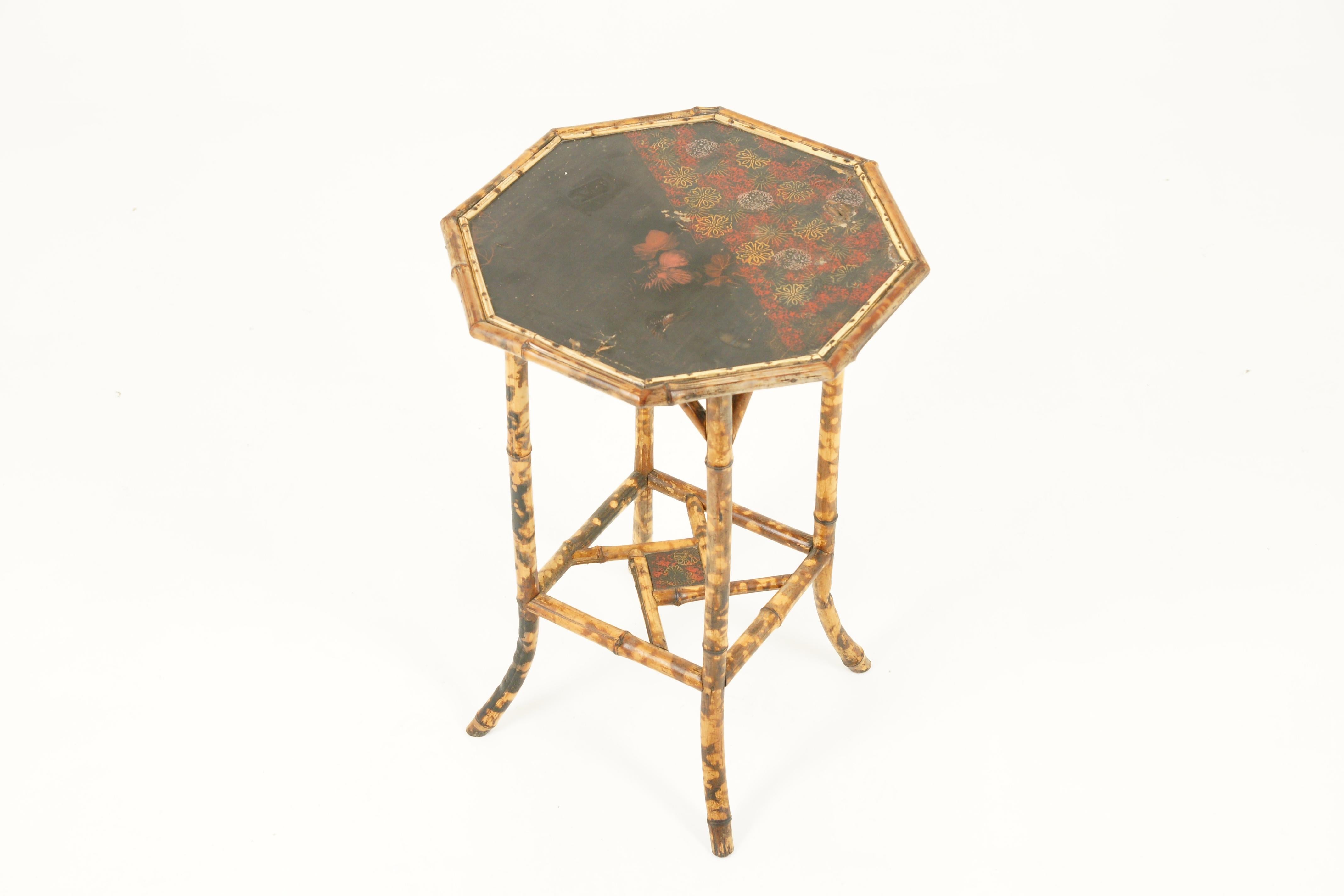 Antique Victorian octagonal two-tier bamboo lamp side table, Scotland 1870, Antique Furniture
Classic octagonal shape
Aged patina to the original top with foliage theme
Sitting on four shaped bamboo legs
Lower small lacquered shelf joined by