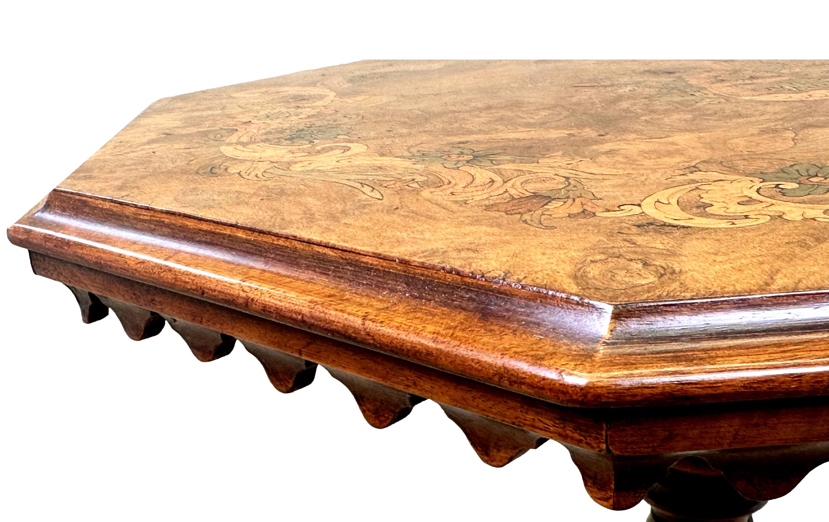 A Very Good Quality Mid 19th Century Victorian Burr Walnut Occasional Table, Having Superbly Figured Octagonal Top, With Profuse Marquetry Inlaid Decoration And Elegant Shaped Frieze, Raised Twisted, Turned Cenral Column Terminating On Moulded