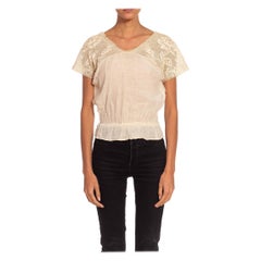 Top vittoriano in pizzo di cotone bianco sporco con vita elastica