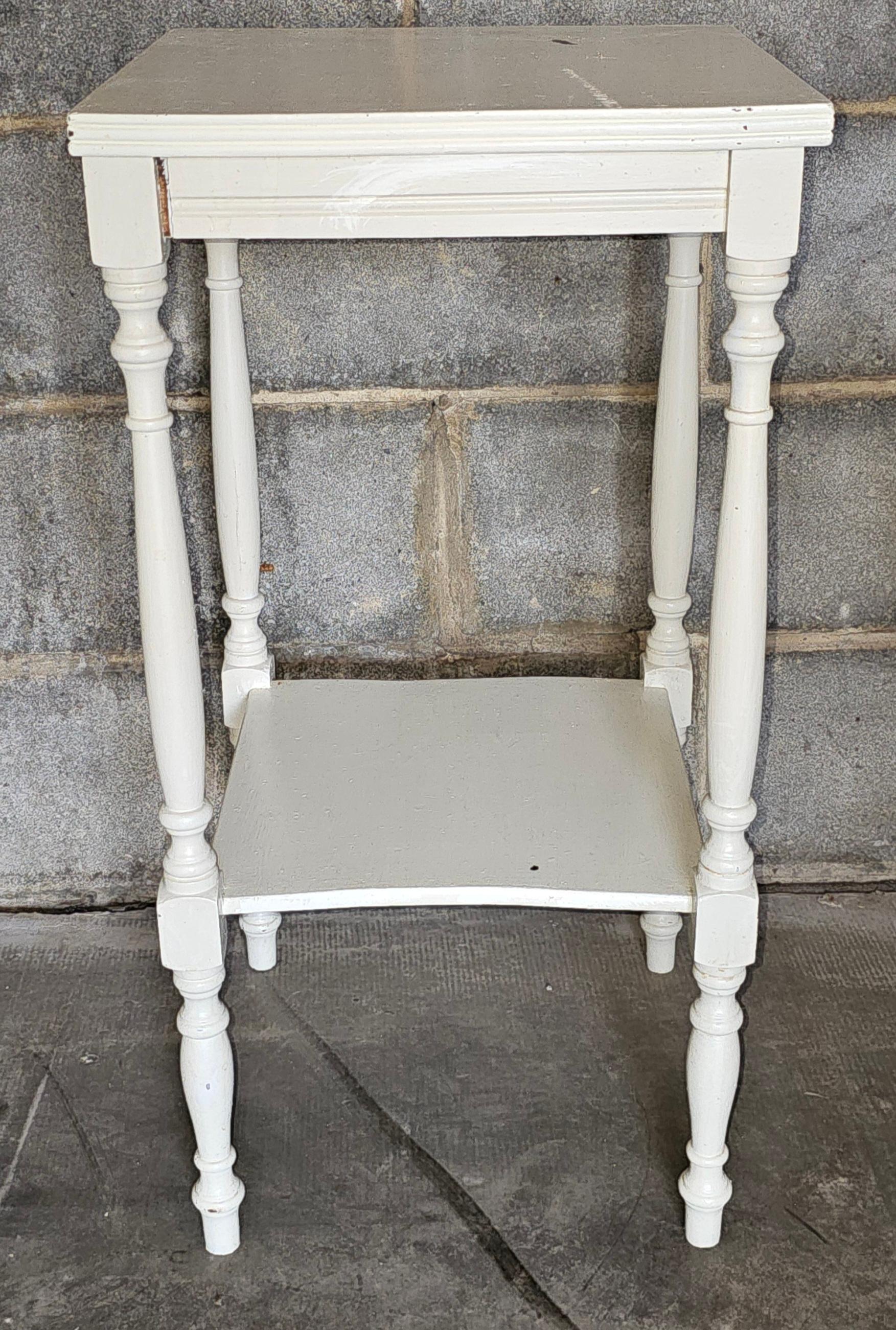 A Victorian Off-White Enameled Maple Two-Tier Side Table
Measures 15