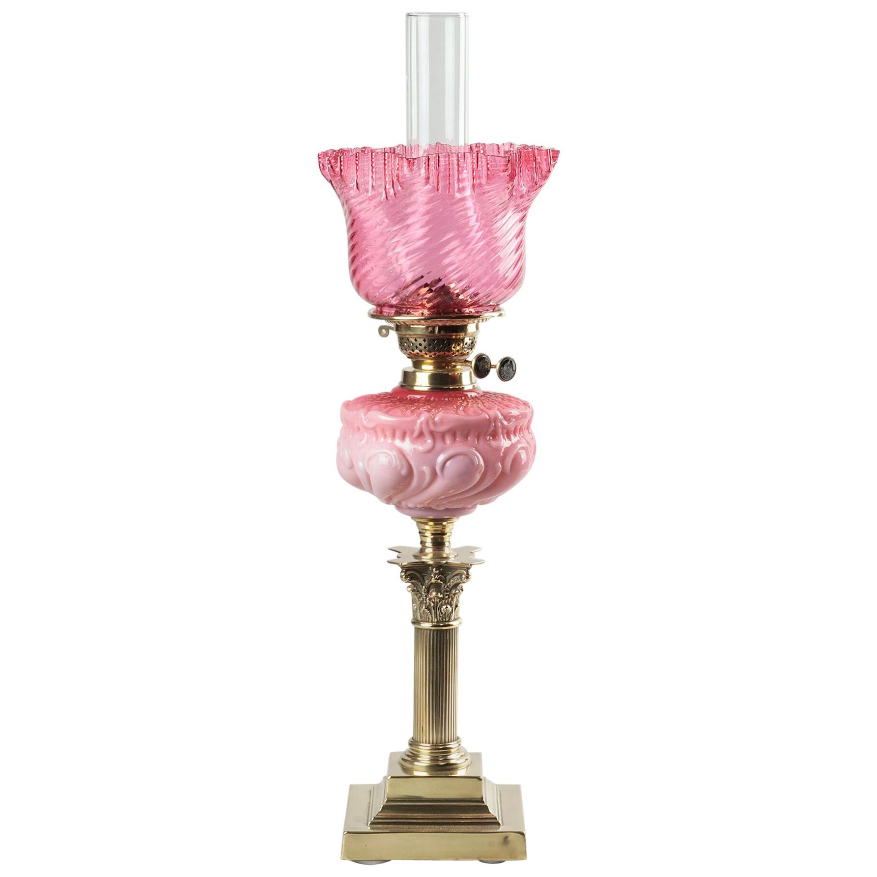 Victorian Oil lamp with Brass Foot and Pink Glass Shade