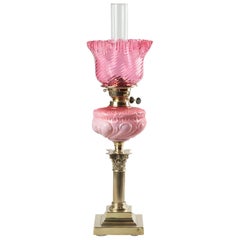 Victorian Oil lamp with Brass Foot and Pink Glass Shade