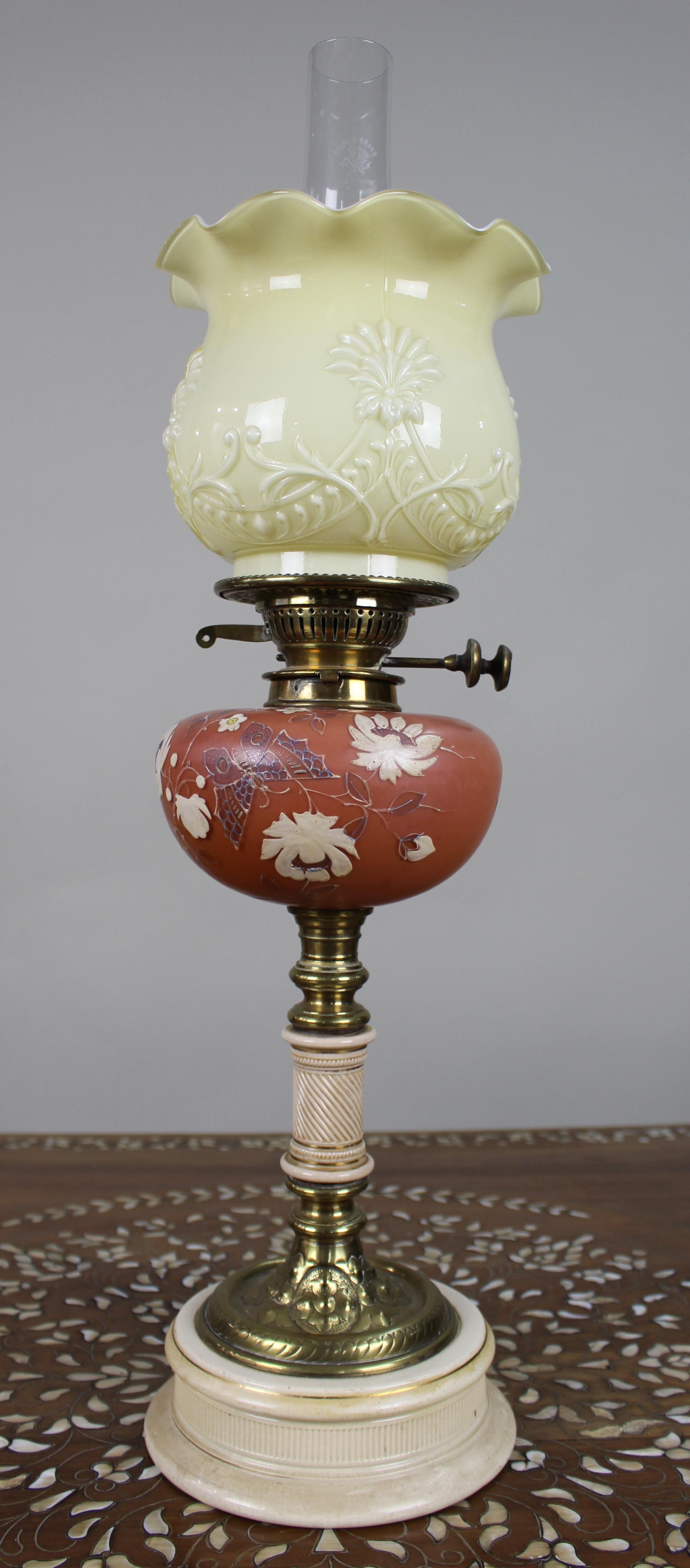 Victorian Oil Lamp with Painted Floral Font and Duplex Burner, c.1890

A decorative late Victorian oil lamp of good scale and presence, dating to around 1890 and fitted with a brass Bruxelles duplex burner. The glass font is of terracotta-red