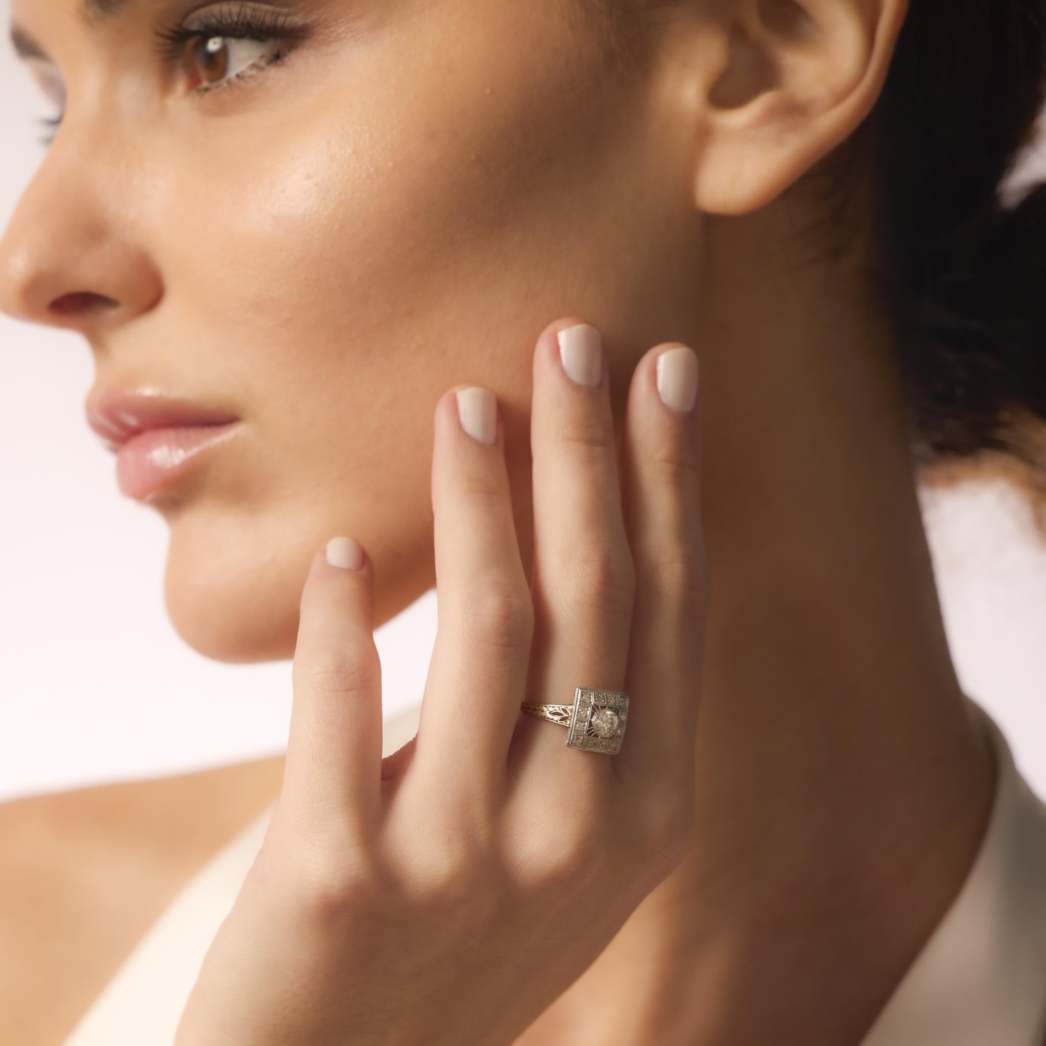 This antique ring combines a .40 carat old European cut diamond with old mine accents in warm yellow gold and platinum, radiating timeless Victorian charm.