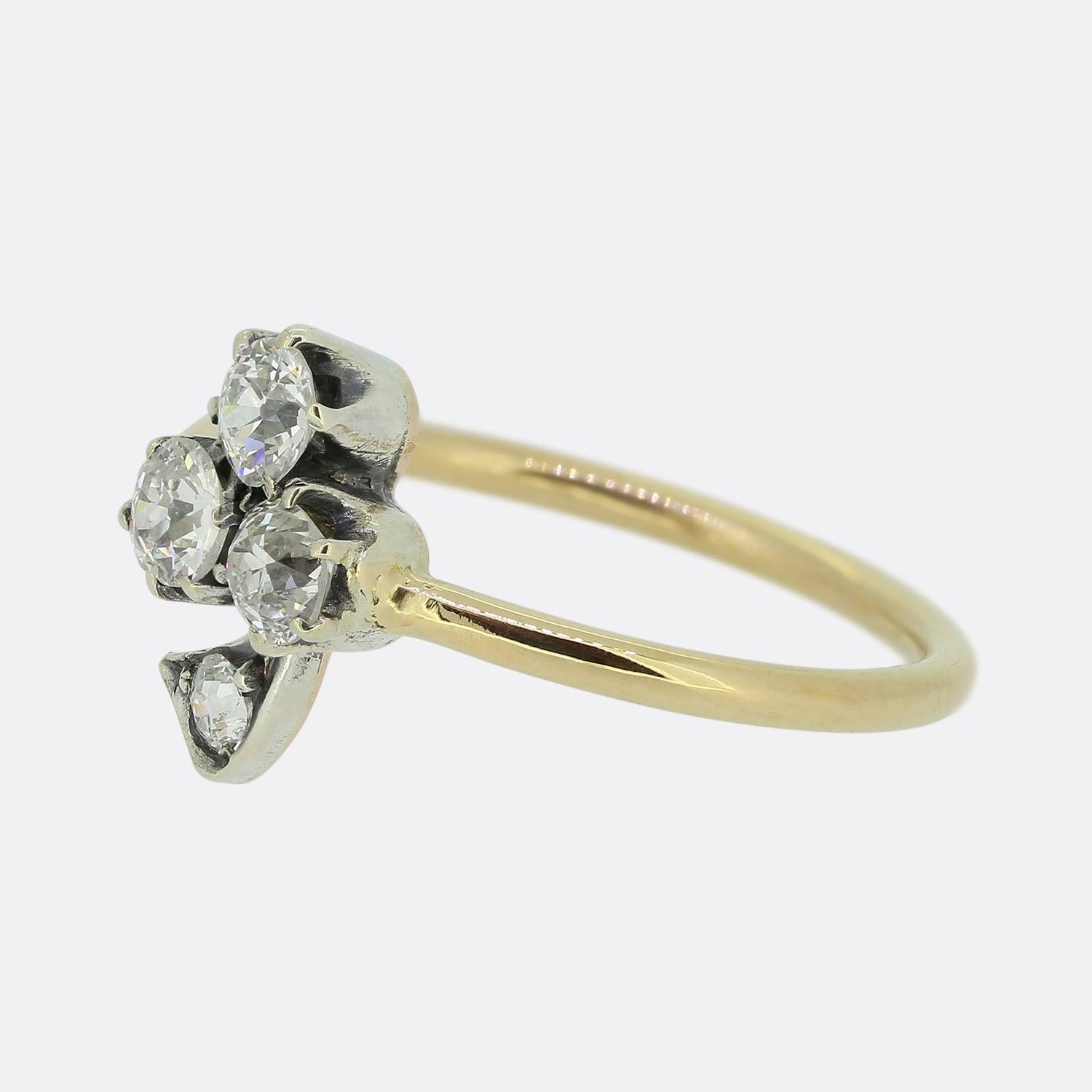 Here we have a charming Victorian clover ring. This piece is platinum set with a trio of round faceted old cut diamonds collectively forming the clover motif.  This delightful piece is then finished with a rose cut diamond stem and yellow gold band.