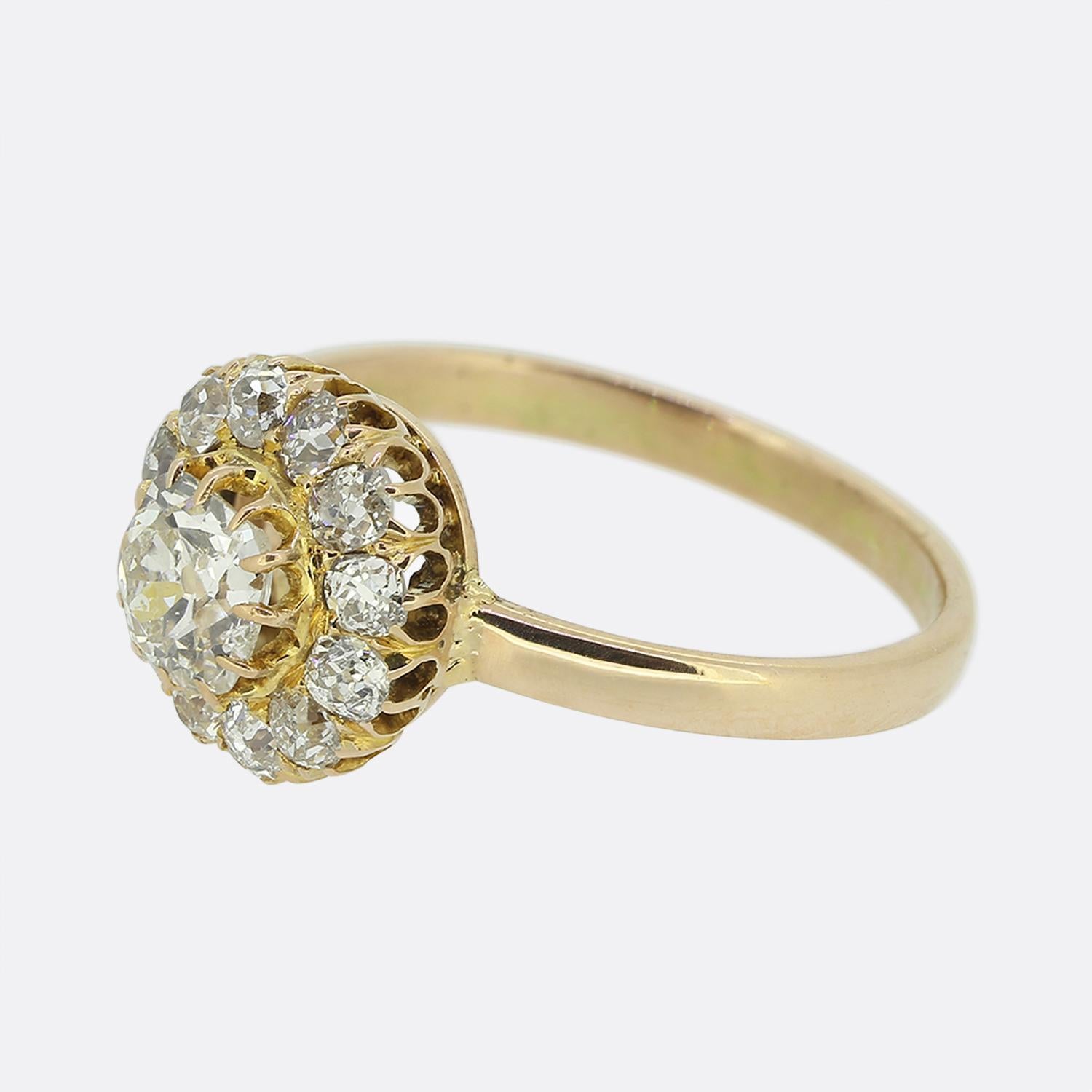 This is a wonderful 15ct rose gold antique diamond cluster ring. The ring features a central 0.45 carat old cut diamond that is surrounded by a further 12 smaller old cut diamonds. Each of the diamonds are claw set and they are well matched for