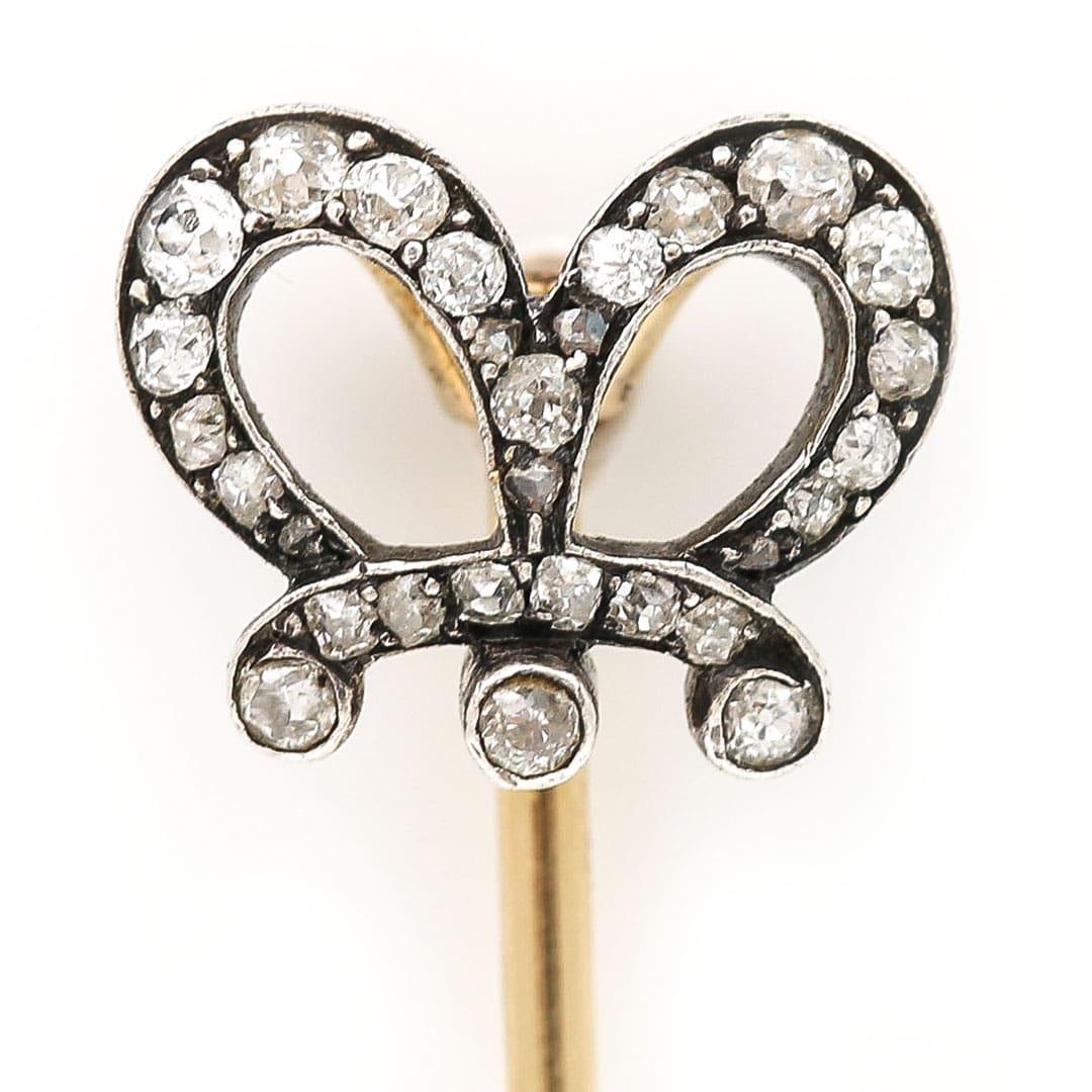 A fabulous regal Victorian stick pin the head of which is styled as a crown coronet set with old cut diamonds. Dating from the late 19th century this stick pin has all the appeal for those looking for a royal stick pin with lots of character. The