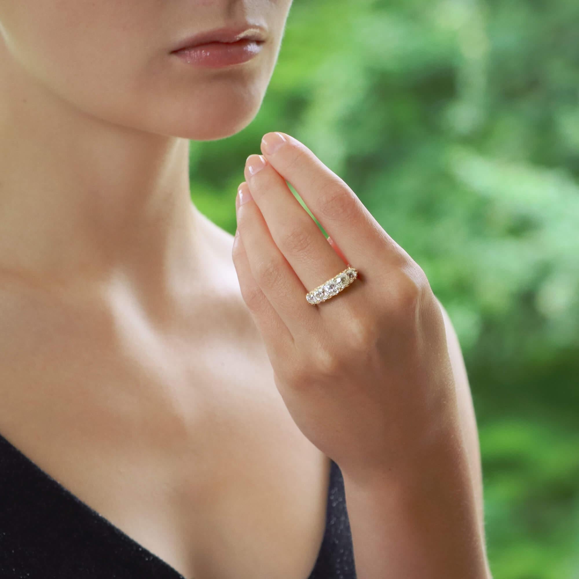 A fabulous Victorian five-stone diamond engagement ring in 18k yellow gold. 

The piece is claw-set with five beautiful old mine-cut diamonds which all slightly graduate in size giving this lovely symmetry on the hand. There are rose-cut accent